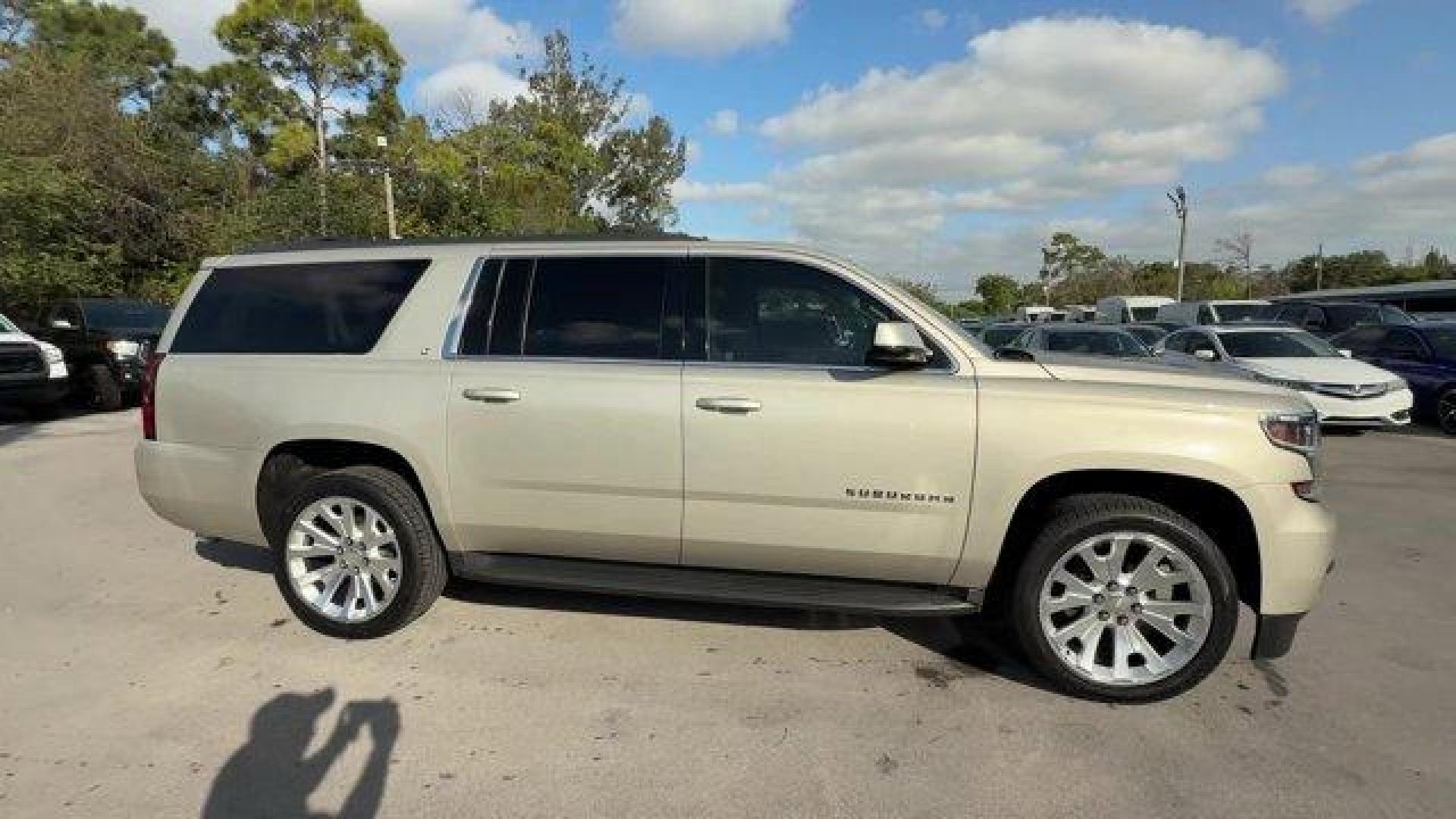 2015 Champagne Silver Metallic /Cocoa/Dune Chevrolet Suburban (1GNSCJKC9FR) with an 8 5.3L engine, Automatic transmission, located at 27610 S Dixie Hwy, Homestead, FL, 33032, (305) 749-2348, 25.510241, -80.438301 - KBB.com Best Resale Value Awards. Boasts 23 Highway MPG and 16 City MPG! This Chevrolet Suburban boasts a Gas/Ethanol V8 5.3L/ engine powering this Automatic transmission. WHEELS, 22 X 9 STEEL, INTERIM, TRANSMISSION, 6-SPEED AUTOMATIC, ELECTRONICALLY CONTROLLED with overdrive and tow/haul mode (STD) - Photo#5