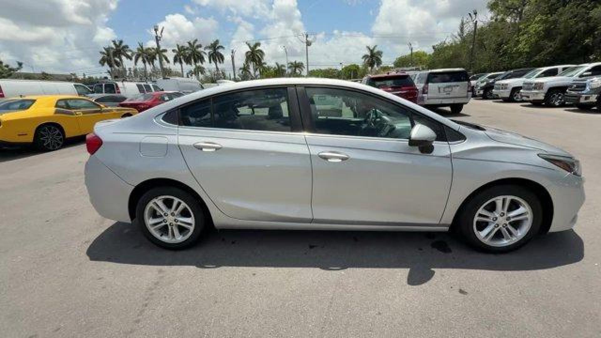 2018 Silver Ice Metallic /Jet Black Chevrolet Cruze (1G1BE5SMXJ7) with an 4 1.4L engine, Automatic transmission, located at 27610 S Dixie Hwy, Homestead, FL, 33032, (305) 749-2348, 25.510241, -80.438301 - KBB.com 10 Most Awarded Brands. Scores 40 Highway MPG and 29 City MPG! This Chevrolet Cruze delivers a Turbocharged Gas I4 1.4L/ engine powering this Automatic transmission. WHEELS, 16 (40.6 CM) ALUMINUM (STD), TRANSMISSION, 6-SPEED AUTOMATIC (STD), TIRES, 205/55R16 ALL-SEASON, BLACKWALL.* This Chev - Photo#5