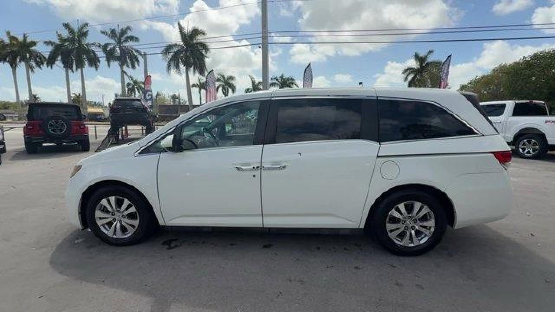 2014 White Honda Odyssey (5FNRL5H66EB) with an 6 3.5 L engine, Automatic transmission, located at 27610 S Dixie Hwy, Homestead, FL, 33032, (305) 749-2348, 25.510241, -80.438301 - KBB.com 12 Best Family Cars. Only 127,664 Miles! Boasts 28 Highway MPG and 19 City MPG! This Honda Odyssey boasts a Regular Unleaded V-6 3.5 L/212 engine powering this Automatic transmission. Window Grid Antenna, Wheels: 17 x 7 Alloy, VSA Electronic Stability Control (ESC).*This Honda Odyssey Comes - Photo#1