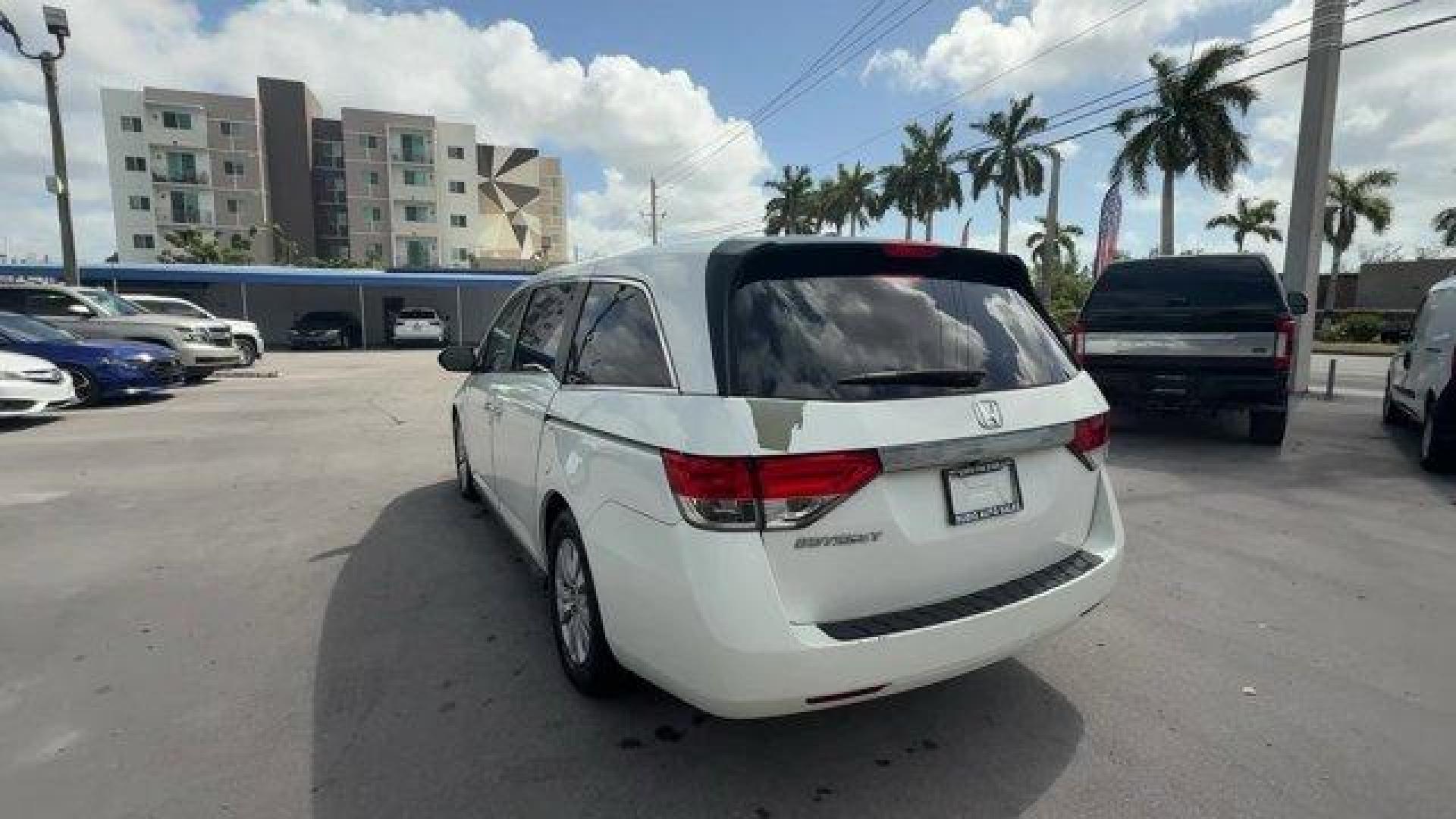 2014 White Honda Odyssey (5FNRL5H66EB) with an 6 3.5 L engine, Automatic transmission, located at 27610 S Dixie Hwy, Homestead, FL, 33032, (305) 749-2348, 25.510241, -80.438301 - KBB.com 12 Best Family Cars. Only 127,664 Miles! Boasts 28 Highway MPG and 19 City MPG! This Honda Odyssey boasts a Regular Unleaded V-6 3.5 L/212 engine powering this Automatic transmission. Window Grid Antenna, Wheels: 17 x 7 Alloy, VSA Electronic Stability Control (ESC).*This Honda Odyssey Comes - Photo#2
