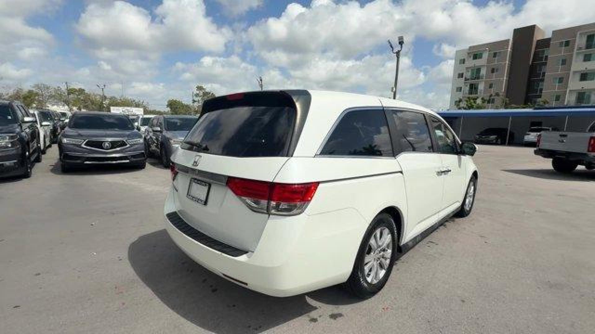 2014 White Honda Odyssey (5FNRL5H66EB) with an 6 3.5 L engine, Automatic transmission, located at 27610 S Dixie Hwy, Homestead, FL, 33032, (305) 749-2348, 25.510241, -80.438301 - KBB.com 12 Best Family Cars. Only 127,664 Miles! Boasts 28 Highway MPG and 19 City MPG! This Honda Odyssey boasts a Regular Unleaded V-6 3.5 L/212 engine powering this Automatic transmission. Window Grid Antenna, Wheels: 17 x 7 Alloy, VSA Electronic Stability Control (ESC).*This Honda Odyssey Comes - Photo#4