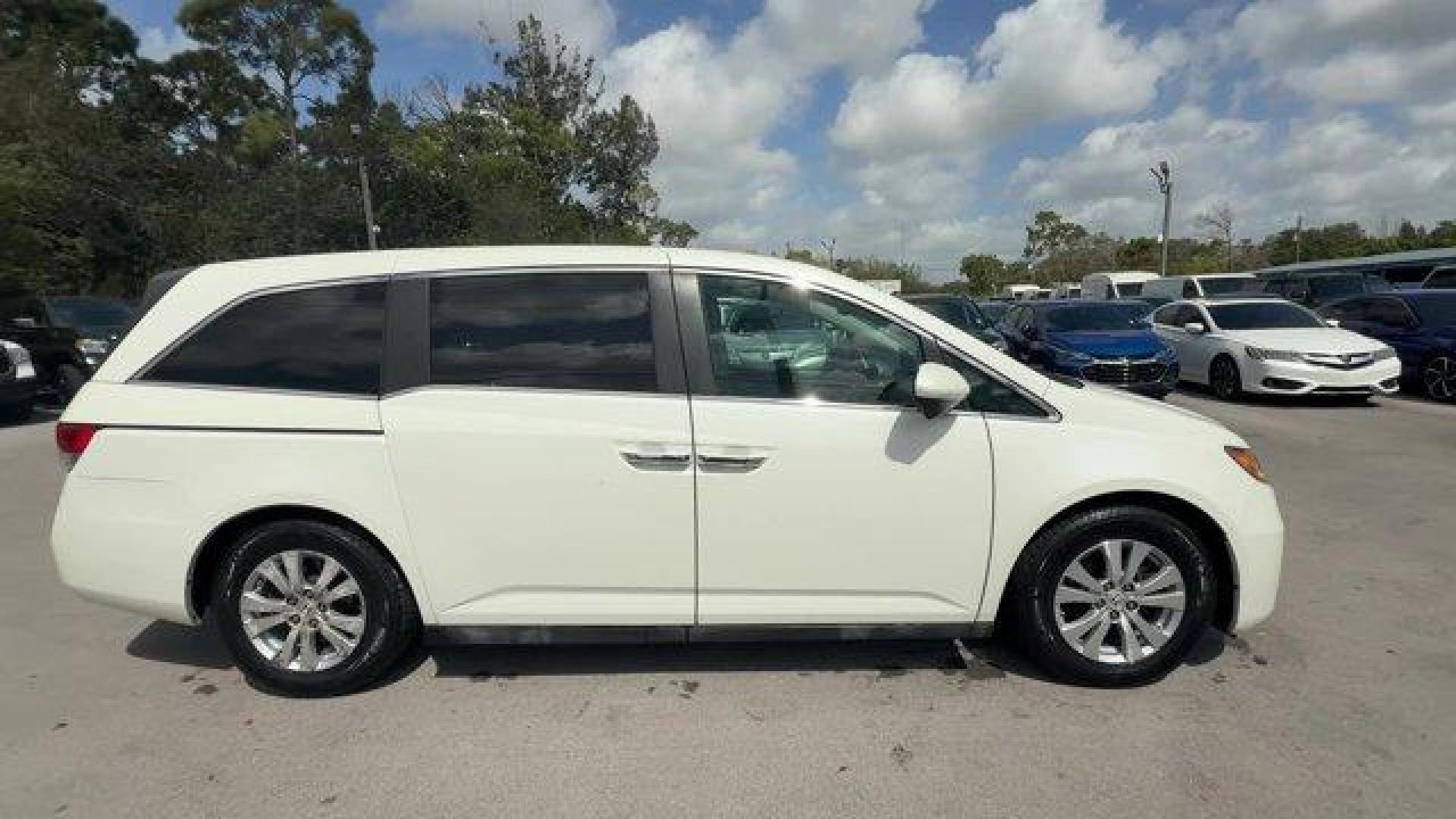 2014 White Honda Odyssey (5FNRL5H66EB) with an 6 3.5 L engine, Automatic transmission, located at 27610 S Dixie Hwy, Homestead, FL, 33032, (305) 749-2348, 25.510241, -80.438301 - KBB.com 12 Best Family Cars. Only 127,664 Miles! Boasts 28 Highway MPG and 19 City MPG! This Honda Odyssey boasts a Regular Unleaded V-6 3.5 L/212 engine powering this Automatic transmission. Window Grid Antenna, Wheels: 17 x 7 Alloy, VSA Electronic Stability Control (ESC).*This Honda Odyssey Comes - Photo#5