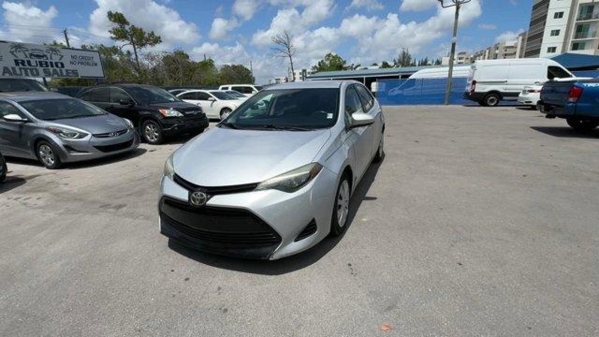 2018 Silver Toyota Corolla (5YFBURHE0JP) with an 4 1.8 L engine, Variable transmission, located at 27610 S Dixie Hwy, Homestead, FL, 33032, (305) 749-2348, 25.510241, -80.438301 - KBB.com 10 Most Awarded Brands. This Toyota Corolla boasts a Regular Unleaded I-4 1.8 L/110 engine powering this Variable transmission. Urethane Gear Shifter Material, Trunk Rear Cargo Access, Trip Computer.*This Toyota Corolla Comes Equipped with These Options *Transmission: Continuously Variable ( - Photo#8