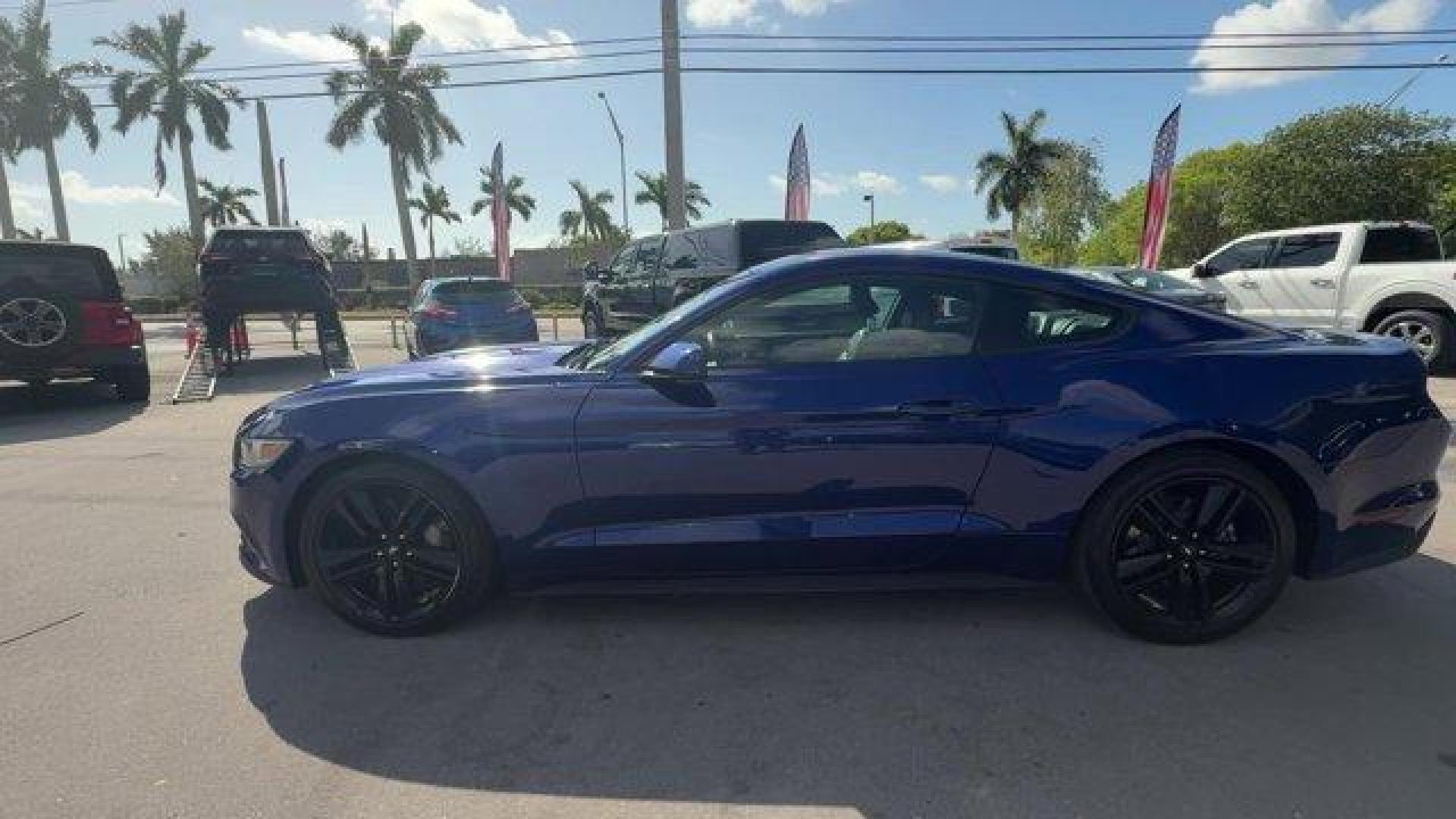 2015 Blue Ford Mustang (1FA6P8TH4F5) with an 4 2.3 L engine, Automatic transmission, located at 27610 S Dixie Hwy, Homestead, FL, 33032, (305) 749-2348, 25.510241, -80.438301 - KBB.com Best Buy Awards Finalist. Only 109,920 Miles! Boasts 31 Highway MPG and 22 City MPG! This Ford Mustang delivers a Intercooled Turbo Premium Unleaded I-4 2.3 L/140 engine powering this Automatic transmission. Trunk Rear Cargo Access, Trip Computer, Transmission: 6-Speed Manual.*This Ford Must - Photo#1