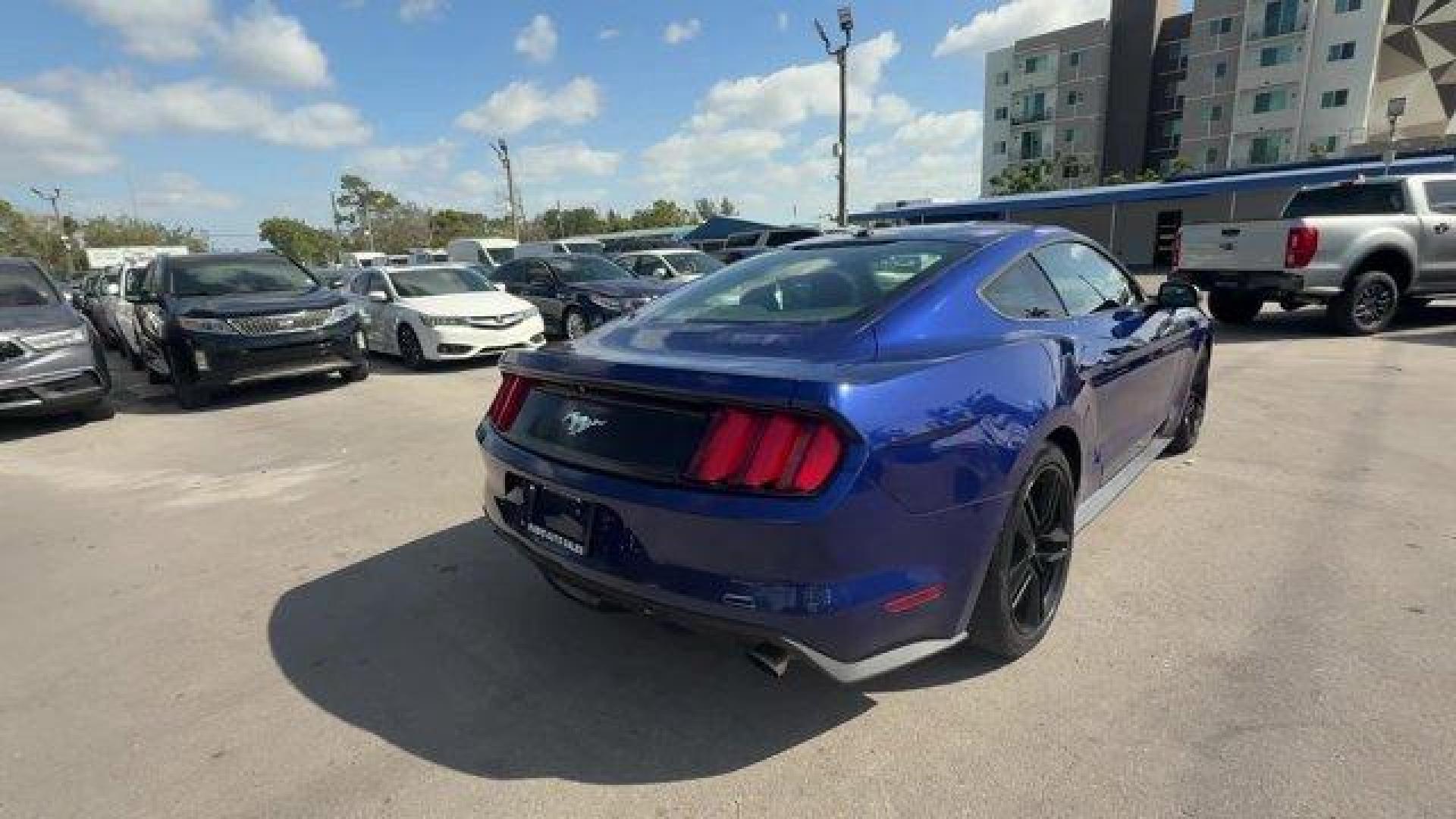 2015 Blue Ford Mustang (1FA6P8TH4F5) with an 4 2.3 L engine, Automatic transmission, located at 27610 S Dixie Hwy, Homestead, FL, 33032, (305) 749-2348, 25.510241, -80.438301 - KBB.com Best Buy Awards Finalist. Only 109,920 Miles! Boasts 31 Highway MPG and 22 City MPG! This Ford Mustang delivers a Intercooled Turbo Premium Unleaded I-4 2.3 L/140 engine powering this Automatic transmission. Trunk Rear Cargo Access, Trip Computer, Transmission: 6-Speed Manual.*This Ford Must - Photo#4