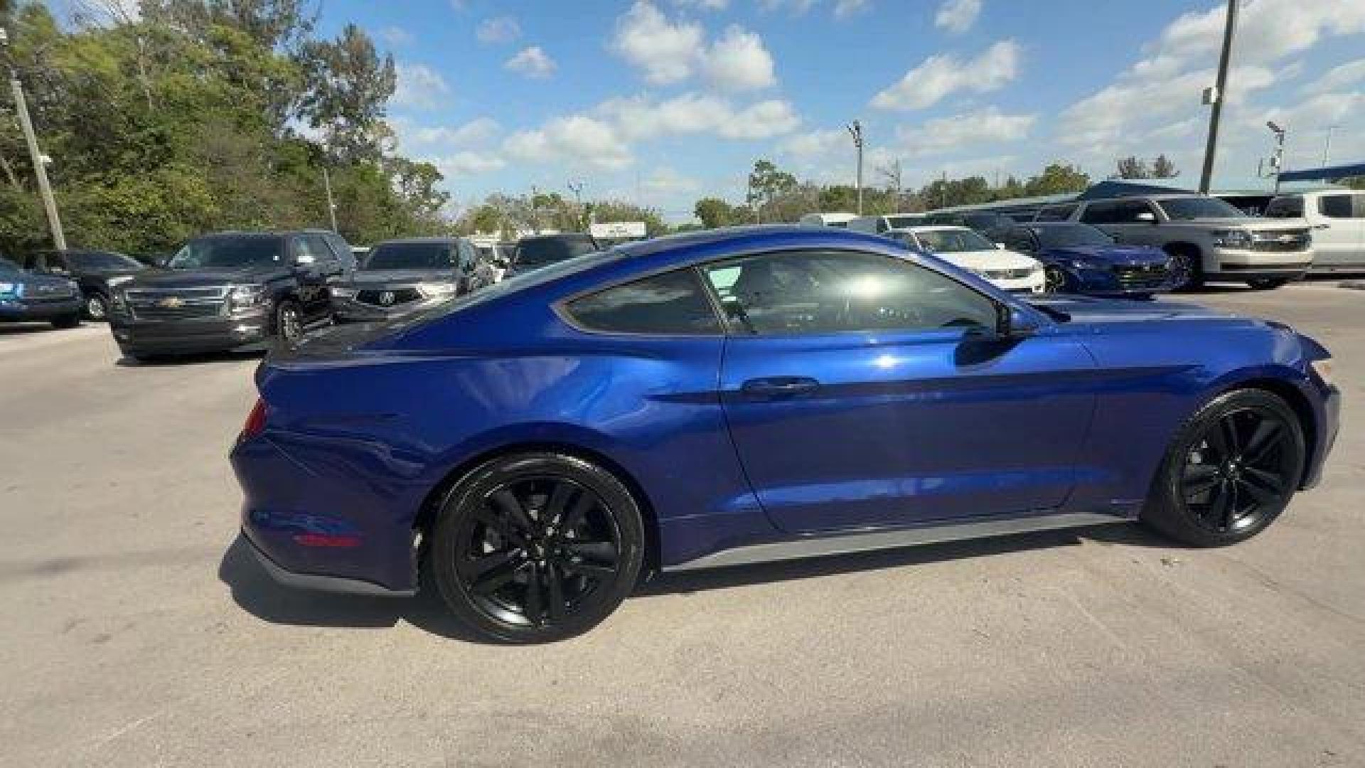 2015 Blue Ford Mustang (1FA6P8TH4F5) with an 4 2.3 L engine, Automatic transmission, located at 27610 S Dixie Hwy, Homestead, FL, 33032, (305) 749-2348, 25.510241, -80.438301 - KBB.com Best Buy Awards Finalist. Only 109,920 Miles! Boasts 31 Highway MPG and 22 City MPG! This Ford Mustang delivers a Intercooled Turbo Premium Unleaded I-4 2.3 L/140 engine powering this Automatic transmission. Trunk Rear Cargo Access, Trip Computer, Transmission: 6-Speed Manual.*This Ford Must - Photo#5