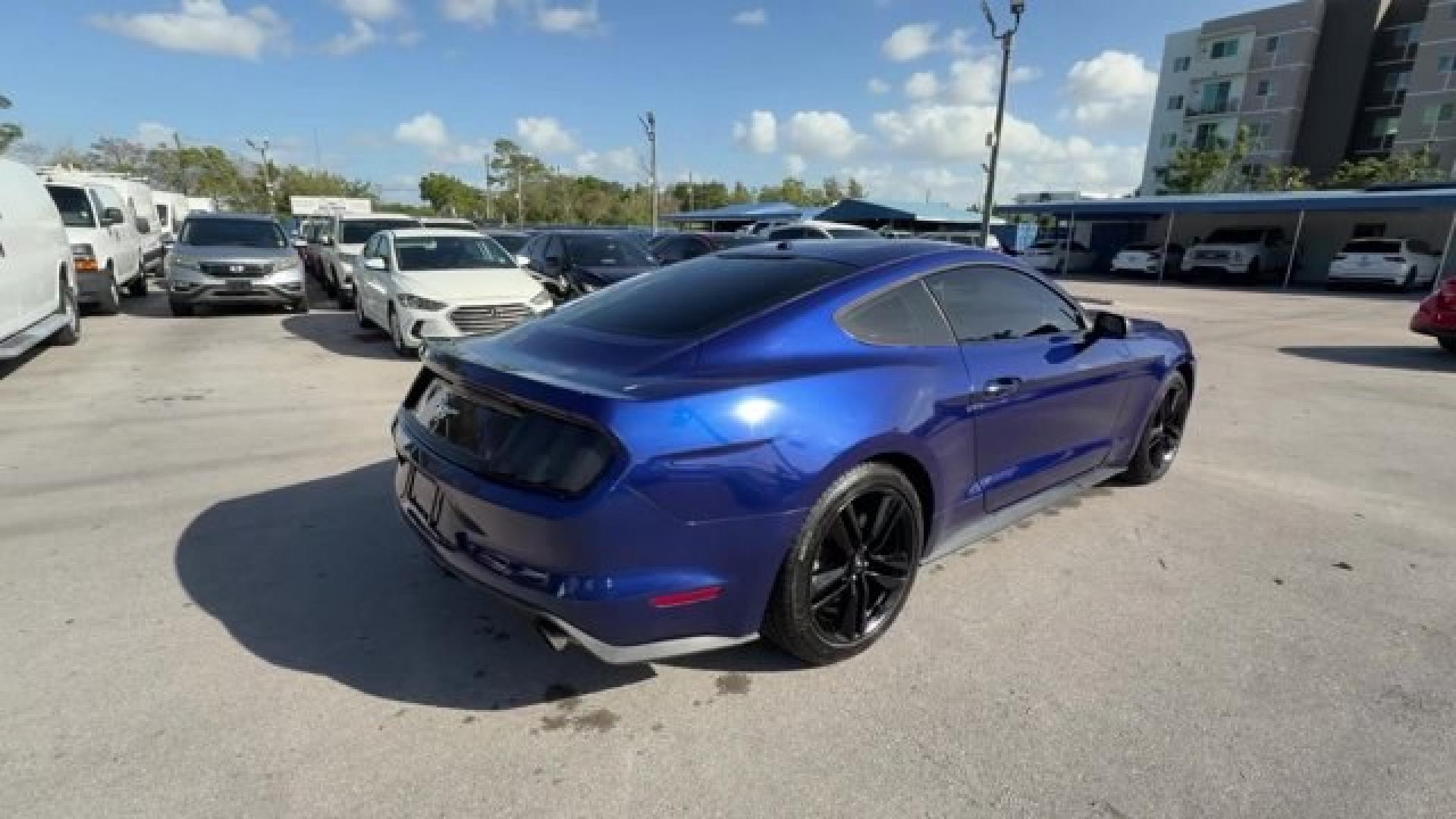 2015 Blue Ford Mustang (1FA6P8TH4F5) with an 4 2.3 L engine, Automatic transmission, located at 27610 S Dixie Hwy, Homestead, FL, 33032, (305) 749-2348, 25.510241, -80.438301 - KBB.com Best Buy Awards Finalist. Only 109,920 Miles! Boasts 31 Highway MPG and 22 City MPG! This Ford Mustang delivers a Intercooled Turbo Premium Unleaded I-4 2.3 L/140 engine powering this Automatic transmission. Trunk Rear Cargo Access, Trip Computer, Transmission: 6-Speed Manual.*This Ford Must - Photo#2
