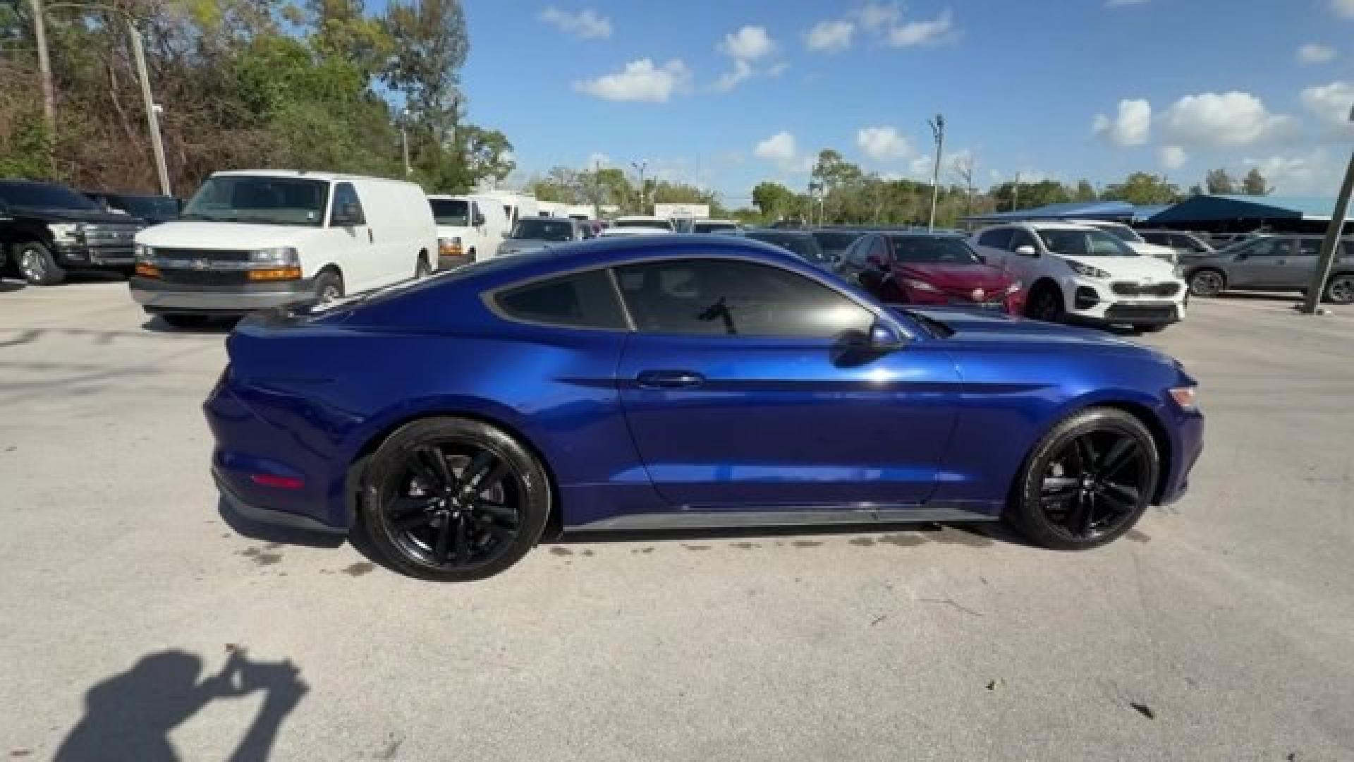 2015 Blue Ford Mustang (1FA6P8TH4F5) with an 4 2.3 L engine, Automatic transmission, located at 27610 S Dixie Hwy, Homestead, FL, 33032, (305) 749-2348, 25.510241, -80.438301 - KBB.com Best Buy Awards Finalist. Only 109,920 Miles! Boasts 31 Highway MPG and 22 City MPG! This Ford Mustang delivers a Intercooled Turbo Premium Unleaded I-4 2.3 L/140 engine powering this Automatic transmission. Trunk Rear Cargo Access, Trip Computer, Transmission: 6-Speed Manual.*This Ford Must - Photo#3
