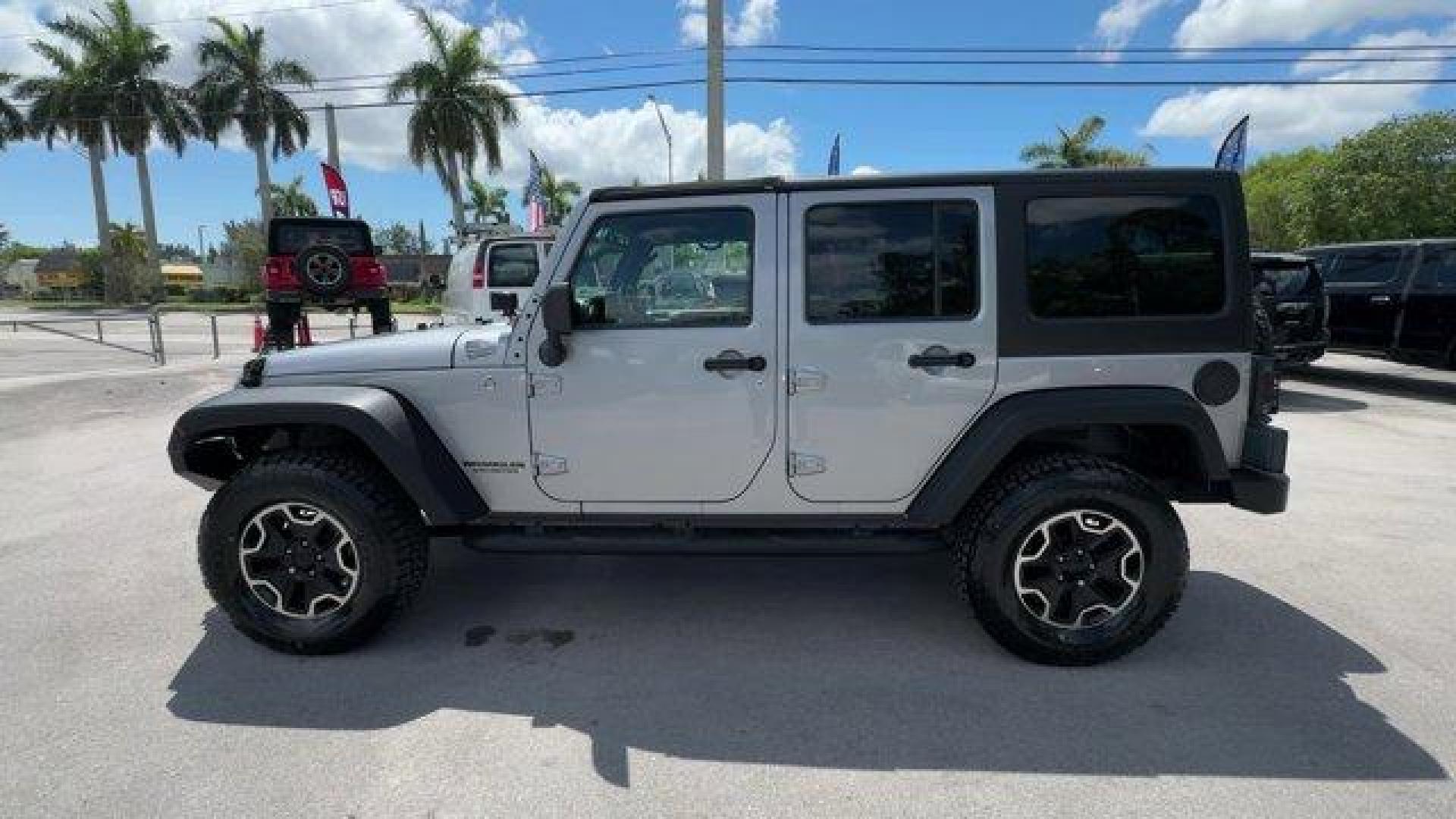 2014 Billet Metallic Clearcoat /Black Jeep Wrangler Unlimited (1C4BJWDG7EL) with an 6 3.6 L engine, Automatic transmission, located at 27610 S Dixie Hwy, Homestead, FL, 33032, (305) 749-2348, 25.510241, -80.438301 - Only 94,538 Miles! Scores 20 Highway MPG and 16 City MPG! This Jeep Wrangler Unlimited boasts a Regular Unleaded V-6 3.6 L/220 engine powering this Automatic transmission. SIRIUS SATELLITE RADIO (subscription required), ENGINE: 3.6L V6 24V VVT (STD), ANTI-SPIN DIFFERENTIAL REAR AXLE.*This Jeep Wrang - Photo#1