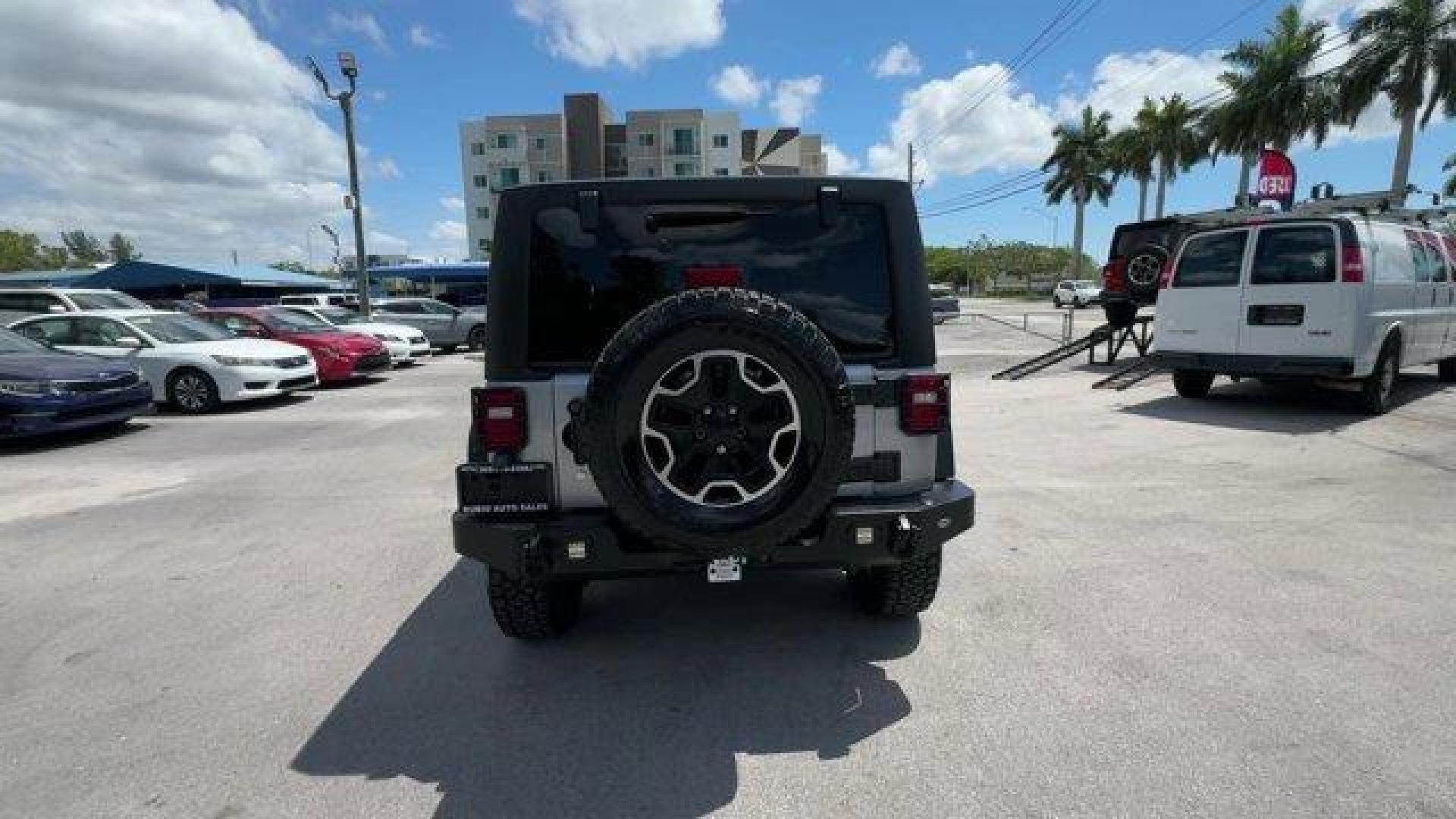 2014 Billet Metallic Clearcoat /Black Jeep Wrangler Unlimited (1C4BJWDG7EL) with an 6 3.6 L engine, Automatic transmission, located at 27610 S Dixie Hwy, Homestead, FL, 33032, (305) 749-2348, 25.510241, -80.438301 - Only 94,538 Miles! Scores 20 Highway MPG and 16 City MPG! This Jeep Wrangler Unlimited boasts a Regular Unleaded V-6 3.6 L/220 engine powering this Automatic transmission. SIRIUS SATELLITE RADIO (subscription required), ENGINE: 3.6L V6 24V VVT (STD), ANTI-SPIN DIFFERENTIAL REAR AXLE.*This Jeep Wrang - Photo#3
