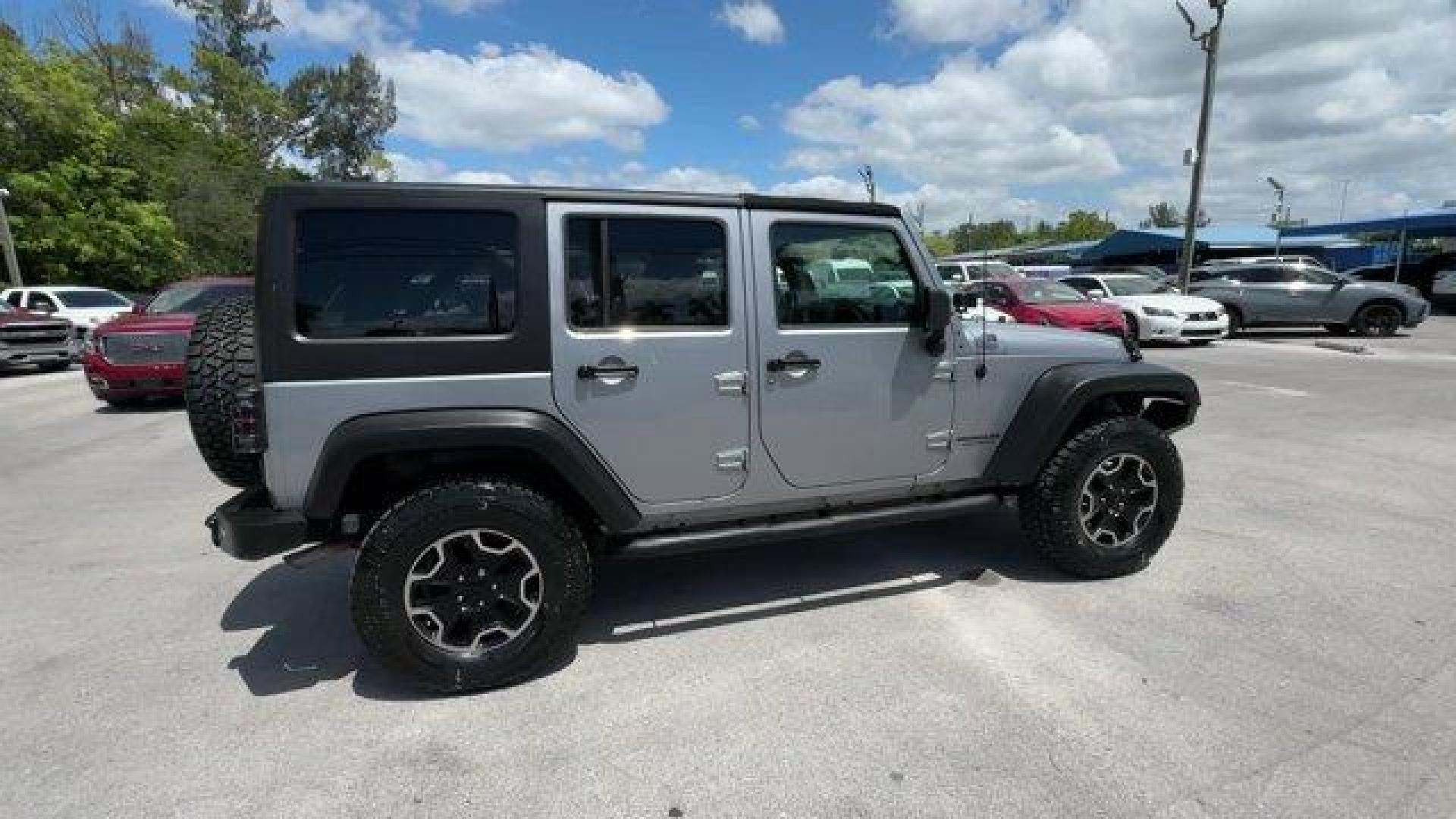 2014 Billet Metallic Clearcoat /Black Jeep Wrangler Unlimited (1C4BJWDG7EL) with an 6 3.6 L engine, Automatic transmission, located at 27610 S Dixie Hwy, Homestead, FL, 33032, (305) 749-2348, 25.510241, -80.438301 - Only 94,538 Miles! Scores 20 Highway MPG and 16 City MPG! This Jeep Wrangler Unlimited boasts a Regular Unleaded V-6 3.6 L/220 engine powering this Automatic transmission. SIRIUS SATELLITE RADIO (subscription required), ENGINE: 3.6L V6 24V VVT (STD), ANTI-SPIN DIFFERENTIAL REAR AXLE.*This Jeep Wrang - Photo#5