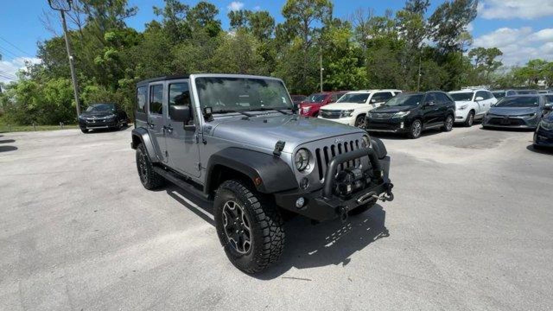 2014 Billet Metallic Clearcoat /Black Jeep Wrangler Unlimited (1C4BJWDG7EL) with an 6 3.6 L engine, Automatic transmission, located at 27610 S Dixie Hwy, Homestead, FL, 33032, (305) 749-2348, 25.510241, -80.438301 - Only 94,538 Miles! Scores 20 Highway MPG and 16 City MPG! This Jeep Wrangler Unlimited boasts a Regular Unleaded V-6 3.6 L/220 engine powering this Automatic transmission. SIRIUS SATELLITE RADIO (subscription required), ENGINE: 3.6L V6 24V VVT (STD), ANTI-SPIN DIFFERENTIAL REAR AXLE.*This Jeep Wrang - Photo#6