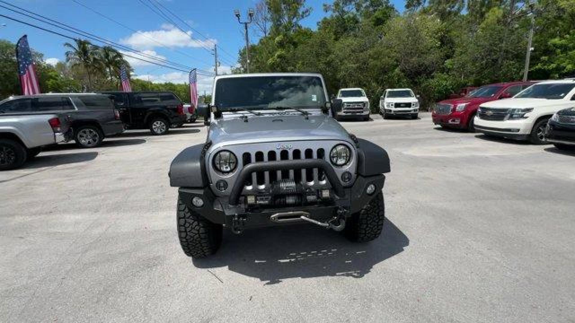 2014 Billet Metallic Clearcoat /Black Jeep Wrangler Unlimited (1C4BJWDG7EL) with an 6 3.6 L engine, Automatic transmission, located at 27610 S Dixie Hwy, Homestead, FL, 33032, (305) 749-2348, 25.510241, -80.438301 - Only 94,538 Miles! Scores 20 Highway MPG and 16 City MPG! This Jeep Wrangler Unlimited boasts a Regular Unleaded V-6 3.6 L/220 engine powering this Automatic transmission. SIRIUS SATELLITE RADIO (subscription required), ENGINE: 3.6L V6 24V VVT (STD), ANTI-SPIN DIFFERENTIAL REAR AXLE.*This Jeep Wrang - Photo#7