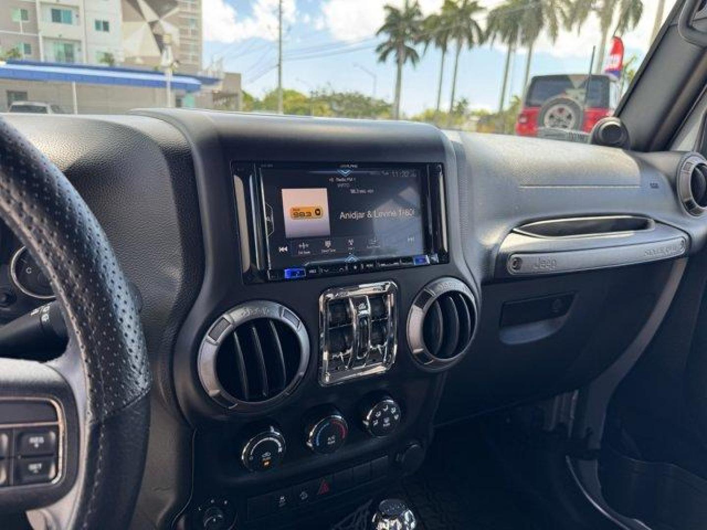 2014 Billet Metallic Clearcoat /Black Jeep Wrangler Unlimited (1C4BJWDG7EL) with an 6 3.6 L engine, Automatic transmission, located at 27610 S Dixie Hwy, Homestead, FL, 33032, (305) 749-2348, 25.510241, -80.438301 - Only 94,538 Miles! Scores 20 Highway MPG and 16 City MPG! This Jeep Wrangler Unlimited boasts a Regular Unleaded V-6 3.6 L/220 engine powering this Automatic transmission. SIRIUS SATELLITE RADIO (subscription required), ENGINE: 3.6L V6 24V VVT (STD), ANTI-SPIN DIFFERENTIAL REAR AXLE.*This Jeep Wrang - Photo#9