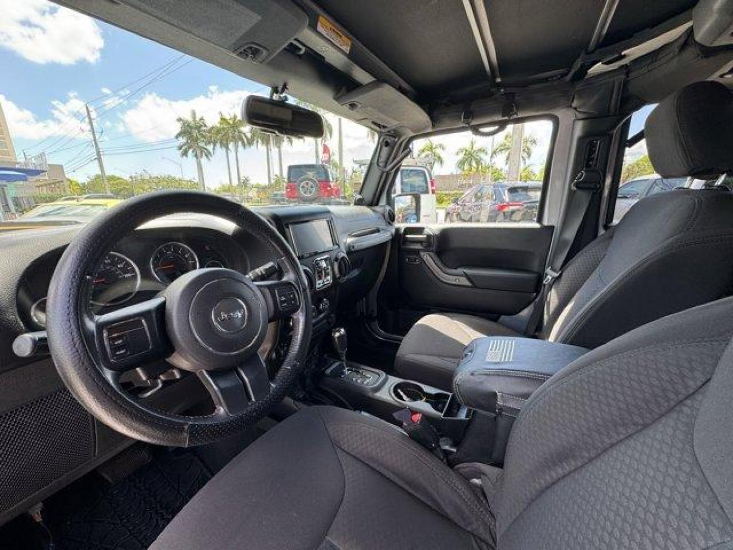2014 Billet Metallic Clearcoat /Black Jeep Wrangler Unlimited (1C4BJWDG7EL) with an 6 3.6 L engine, Automatic transmission, located at 27610 S Dixie Hwy, Homestead, FL, 33032, (305) 749-2348, 25.510241, -80.438301 - Only 94,538 Miles! Scores 20 Highway MPG and 16 City MPG! This Jeep Wrangler Unlimited boasts a Regular Unleaded V-6 3.6 L/220 engine powering this Automatic transmission. SIRIUS SATELLITE RADIO (subscription required), ENGINE: 3.6L V6 24V VVT (STD), ANTI-SPIN DIFFERENTIAL REAR AXLE.*This Jeep Wrang - Photo#10