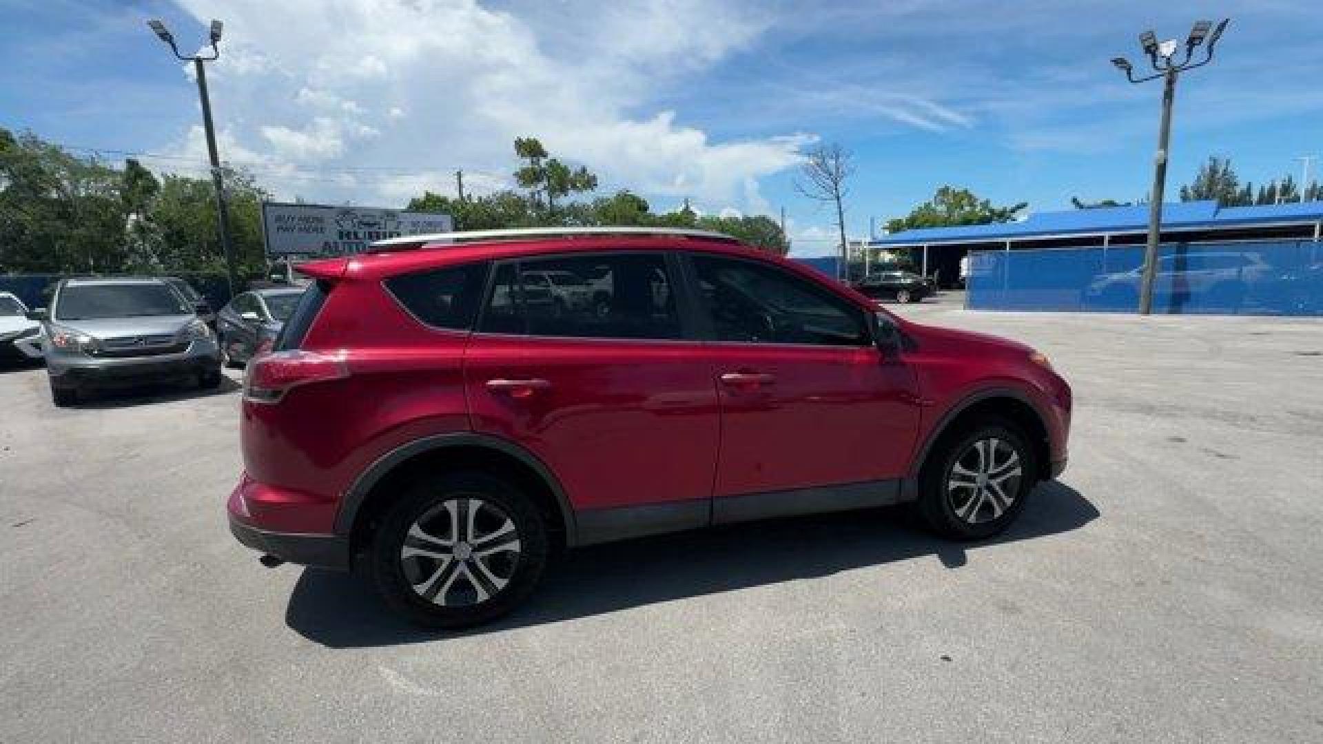 2017 Red Toyota RAV4 (2T3ZFREV3HW) with an 4 2.5 L engine, Automatic transmission, located at 27610 S Dixie Hwy, Homestead, FL, 33032, (305) 749-2348, 25.510241, -80.438301 - IIHS Top Safety Pick+. Only 95,766 Miles! Delivers 30 Highway MPG and 23 City MPG! This Toyota RAV4 boasts a Regular Unleaded I-4 2.5 L/152 engine powering this Automatic transmission. Wheels: 17 x 6.5J -inc: caps, Urethane Gear Shifter Material, Trip Computer.*This Toyota RAV4 Comes Equipped with T - Photo#5