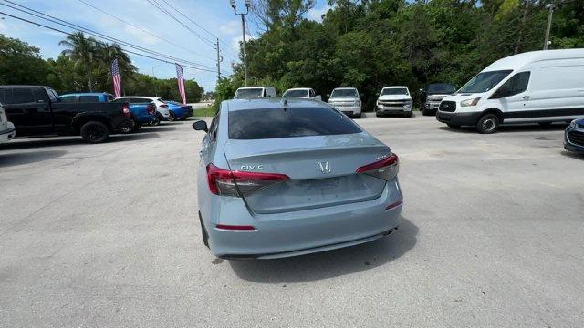 2022 Gray Honda Civic Sedan (2HGFE2F58NH) with an 4 2.0 L engine, Variable transmission, located at 27610 S Dixie Hwy, Homestead, FL, 33032, (305) 749-2348, 25.510241, -80.438301 - NACTOY 2022 North American Car of the Year. Only 35,420 Miles! Scores 37 Highway MPG and 30 City MPG! This Honda Civic Sedan boasts a Regular Unleaded I-4 2.0 L/122 engine powering this Variable transmission. Vehicle Stability Assist (VSA) Electronic Stability Control (ESC), Trunk Rear Cargo Access, - Photo#2