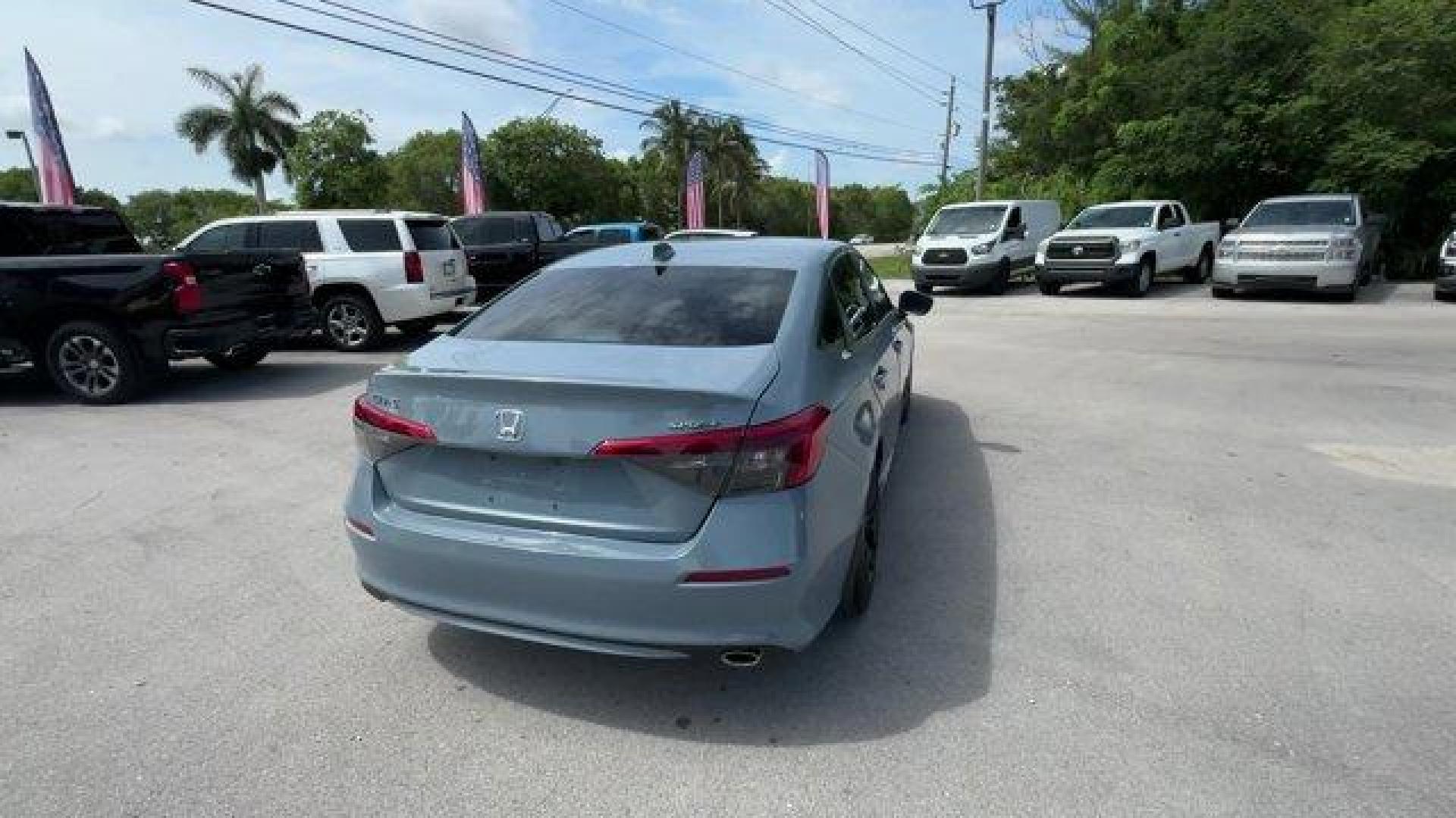 2022 Gray Honda Civic Sedan (2HGFE2F58NH) with an 4 2.0 L engine, Variable transmission, located at 27610 S Dixie Hwy, Homestead, FL, 33032, (305) 749-2348, 25.510241, -80.438301 - NACTOY 2022 North American Car of the Year. Only 35,420 Miles! Scores 37 Highway MPG and 30 City MPG! This Honda Civic Sedan boasts a Regular Unleaded I-4 2.0 L/122 engine powering this Variable transmission. Vehicle Stability Assist (VSA) Electronic Stability Control (ESC), Trunk Rear Cargo Access, - Photo#3