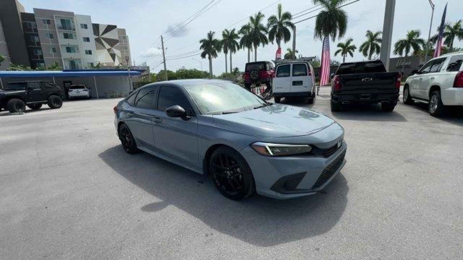 2022 Gray Honda Civic Sedan (2HGFE2F58NH) with an 4 2.0 L engine, Variable transmission, located at 27610 S Dixie Hwy, Homestead, FL, 33032, (305) 749-2348, 25.510241, -80.438301 - NACTOY 2022 North American Car of the Year. Only 35,420 Miles! Scores 37 Highway MPG and 30 City MPG! This Honda Civic Sedan boasts a Regular Unleaded I-4 2.0 L/122 engine powering this Variable transmission. Vehicle Stability Assist (VSA) Electronic Stability Control (ESC), Trunk Rear Cargo Access, - Photo#5