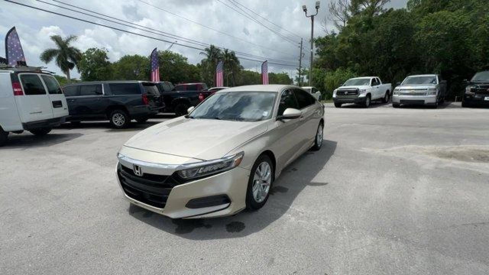 2018 Gold Honda Accord Sedan (1HGCV1F19JA) with an 4 1.5 L engine, Variable transmission, located at 27610 S Dixie Hwy, Homestead, FL, 33032, (305) 749-2348, 25.510241, -80.438301 - ALG Residual Value Awards, Residual Value Awards. Boasts 38 Highway MPG and 30 City MPG! This Honda Accord Sedan delivers a Intercooled Turbo Regular Unleaded I-4 1.5 L/91 engine powering this Variable transmission. Wheels: 17 Silver-Painted Alloy, VSA Electronic Stability Control (ESC), Valet Funct - Photo#0