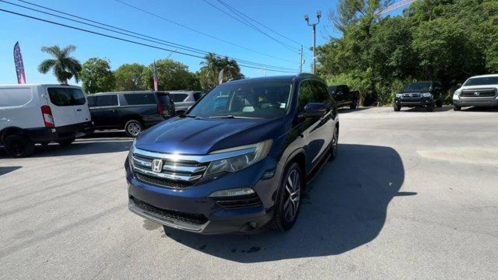 2017 Blue Honda Pilot (5FNYF5H96HB) with an 6 3.5 L engine, Automatic transmission, located at 27610 S Dixie Hwy, Homestead, FL, 33032, (305) 749-2348, 25.510241, -80.438301 - IIHS Top Safety Pick+. Boasts 27 Highway MPG and 20 City MPG! This Honda Pilot boasts a Regular Unleaded V-6 3.5 L/212 engine powering this Automatic transmission. Window Grid Antenna, Wheels: 20 Alloy, Wheels w/Machined Accents.*This Honda Pilot Comes Equipped with These Options *VSA Electronic Sta - Photo#0