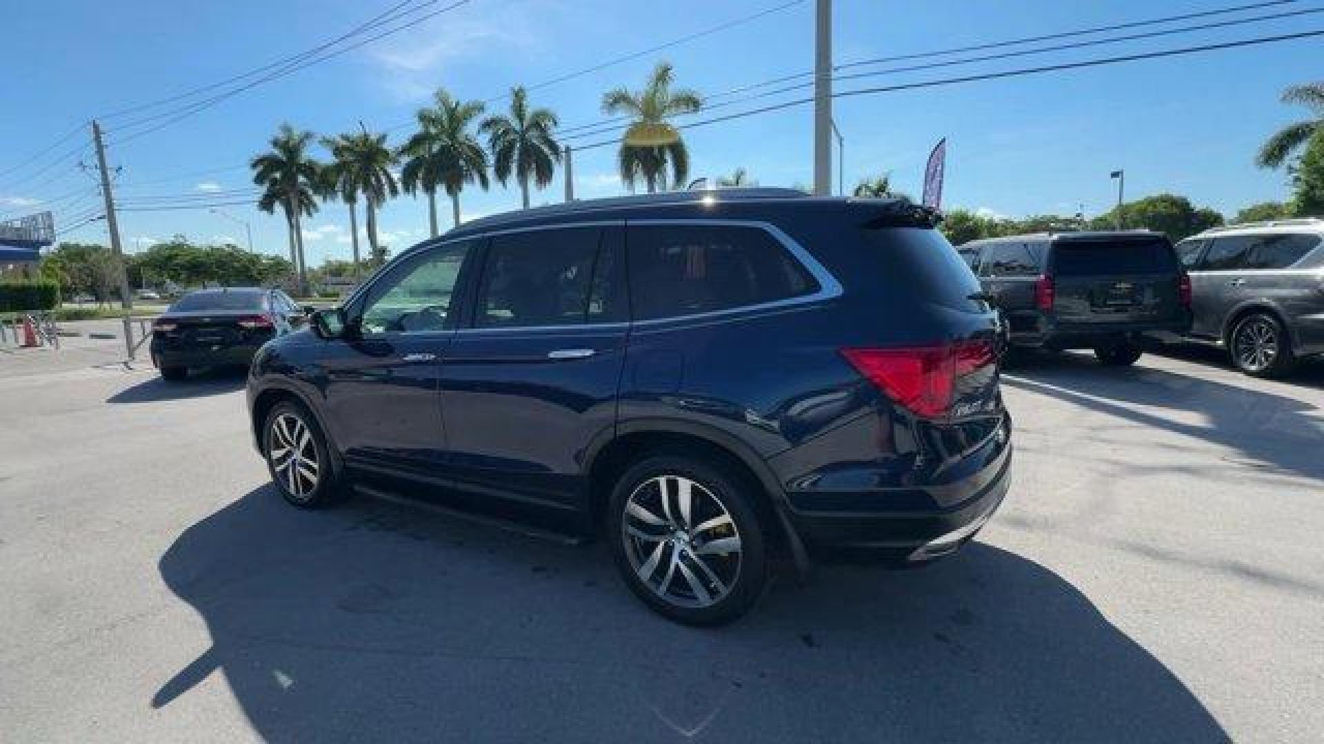 2017 Blue Honda Pilot (5FNYF5H96HB) with an 6 3.5 L engine, Automatic transmission, located at 27610 S Dixie Hwy, Homestead, FL, 33032, (305) 749-2348, 25.510241, -80.438301 - IIHS Top Safety Pick+. Boasts 27 Highway MPG and 20 City MPG! This Honda Pilot boasts a Regular Unleaded V-6 3.5 L/212 engine powering this Automatic transmission. Window Grid Antenna, Wheels: 20 Alloy, Wheels w/Machined Accents.*This Honda Pilot Comes Equipped with These Options *VSA Electronic Sta - Photo#2