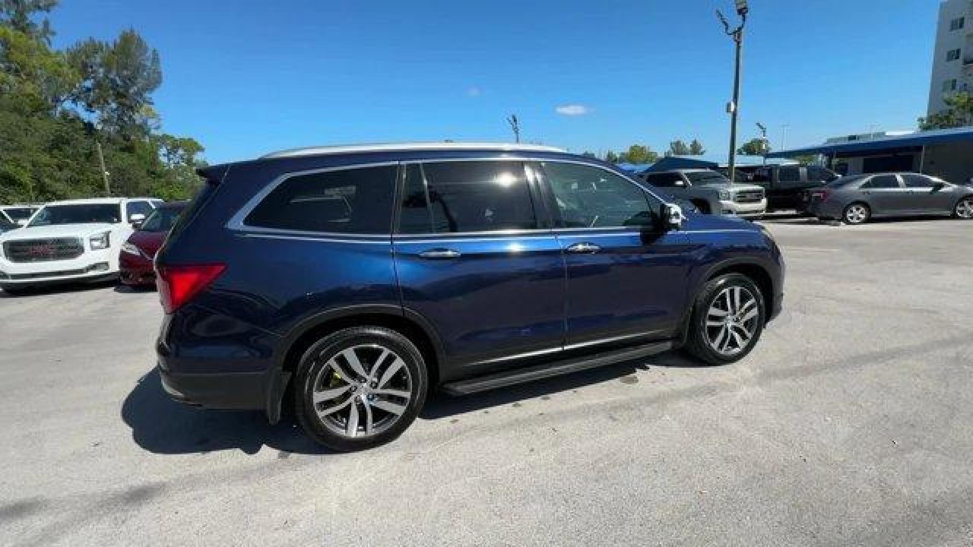 2017 Blue Honda Pilot (5FNYF5H96HB) with an 6 3.5 L engine, Automatic transmission, located at 27610 S Dixie Hwy, Homestead, FL, 33032, (305) 749-2348, 25.510241, -80.438301 - IIHS Top Safety Pick+. Boasts 27 Highway MPG and 20 City MPG! This Honda Pilot boasts a Regular Unleaded V-6 3.5 L/212 engine powering this Automatic transmission. Window Grid Antenna, Wheels: 20 Alloy, Wheels w/Machined Accents.*This Honda Pilot Comes Equipped with These Options *VSA Electronic Sta - Photo#5