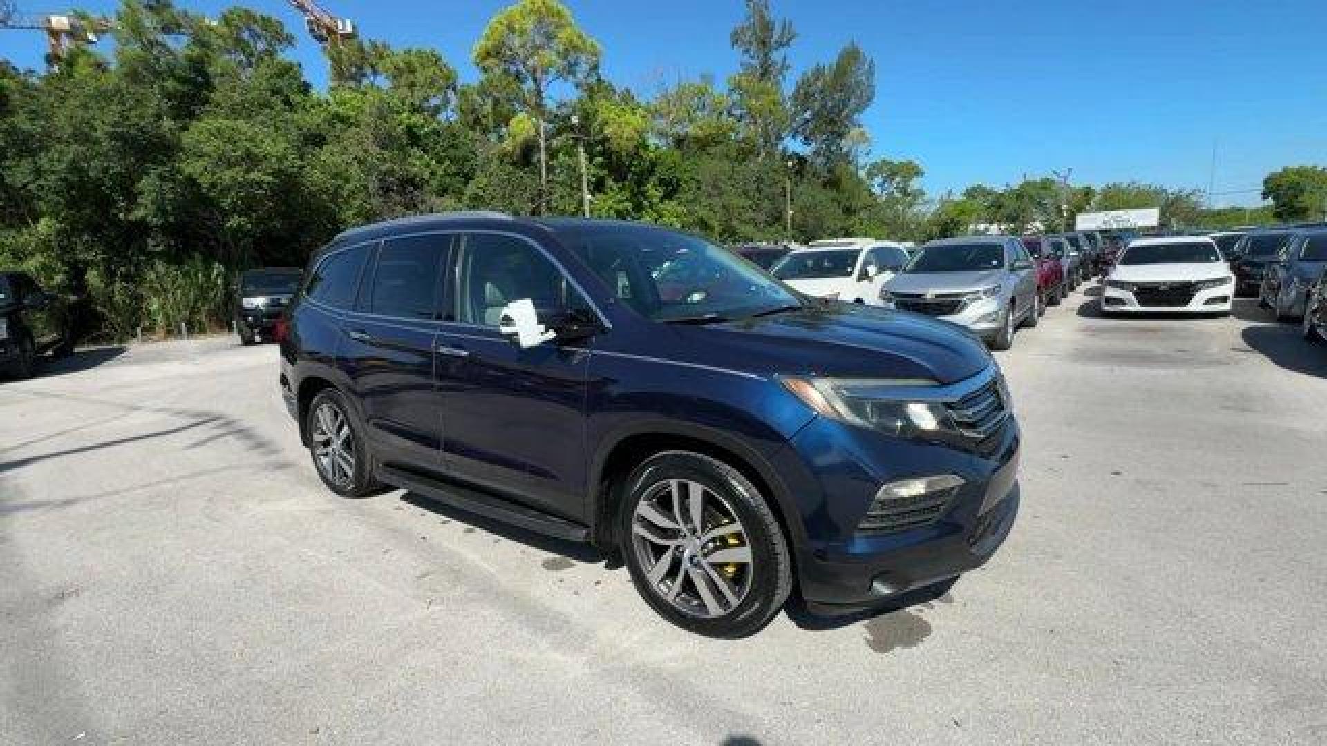2017 Blue Honda Pilot (5FNYF5H96HB) with an 6 3.5 L engine, Automatic transmission, located at 27610 S Dixie Hwy, Homestead, FL, 33032, (305) 749-2348, 25.510241, -80.438301 - IIHS Top Safety Pick+. Boasts 27 Highway MPG and 20 City MPG! This Honda Pilot boasts a Regular Unleaded V-6 3.5 L/212 engine powering this Automatic transmission. Window Grid Antenna, Wheels: 20 Alloy, Wheels w/Machined Accents.*This Honda Pilot Comes Equipped with These Options *VSA Electronic Sta - Photo#6