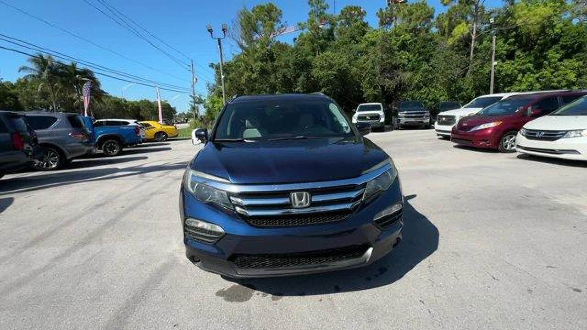 2017 Blue Honda Pilot (5FNYF5H96HB) with an 6 3.5 L engine, Automatic transmission, located at 27610 S Dixie Hwy, Homestead, FL, 33032, (305) 749-2348, 25.510241, -80.438301 - IIHS Top Safety Pick+. Boasts 27 Highway MPG and 20 City MPG! This Honda Pilot boasts a Regular Unleaded V-6 3.5 L/212 engine powering this Automatic transmission. Window Grid Antenna, Wheels: 20 Alloy, Wheels w/Machined Accents.*This Honda Pilot Comes Equipped with These Options *VSA Electronic Sta - Photo#7