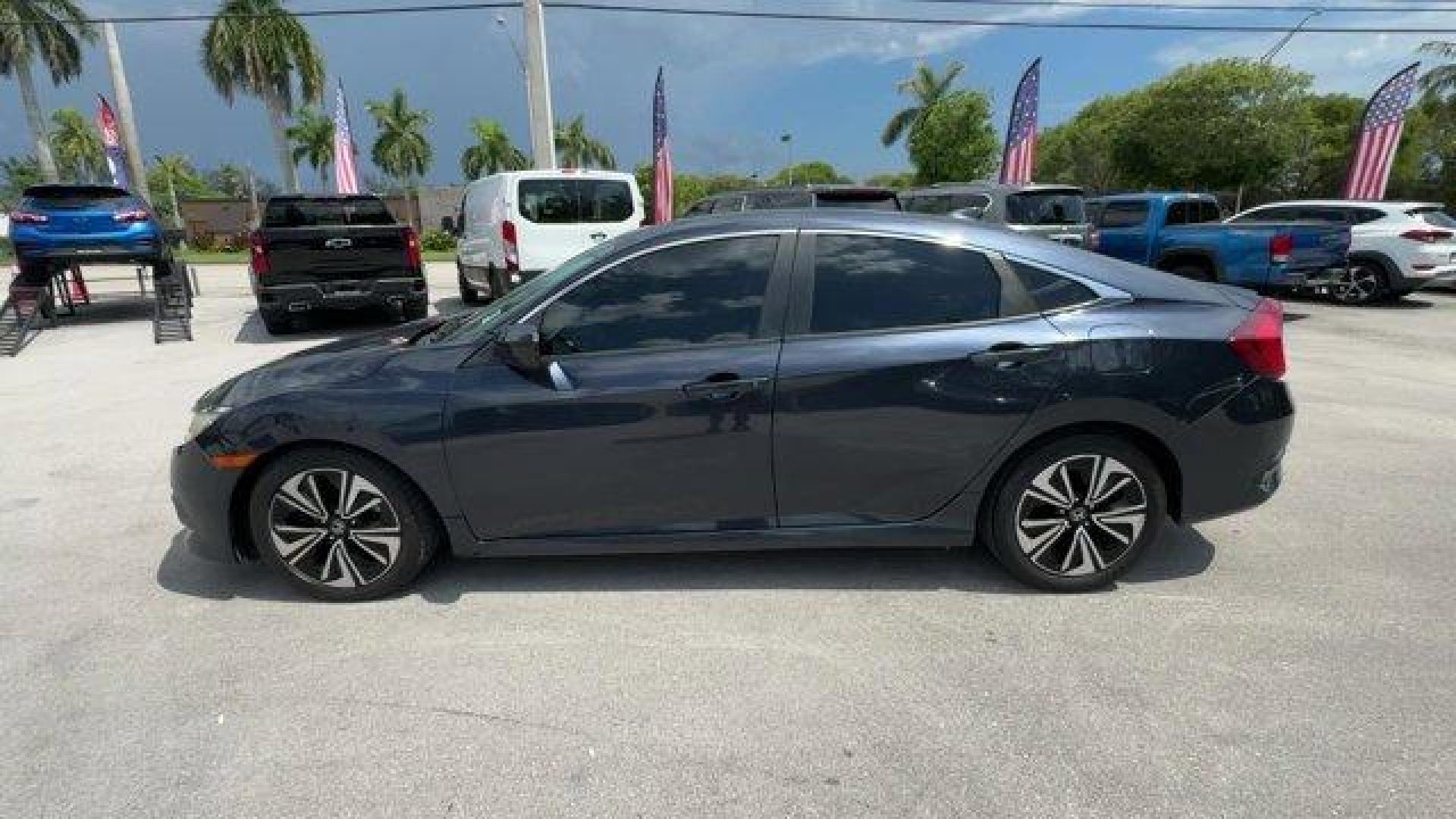 2016 Blue Honda Civic Sedan (19XFC1F36GE) with an 4 1.5 L engine, Variable transmission, located at 27610 S Dixie Hwy, Homestead, FL, 33032, (305) 749-2348, 25.510241, -80.438301 - IIHS Top Safety Pick+. Scores 42 Highway MPG and 31 City MPG! This Honda Civic Sedan delivers a Intercooled Turbo Regular Unleaded I-4 1.5 L/91 engine powering this Variable transmission. Wheels: 17 Alloy, Wheels w/Silver Accents, VSA Electronic Stability Control (ESC).*This Honda Civic Sedan Comes - Photo#1