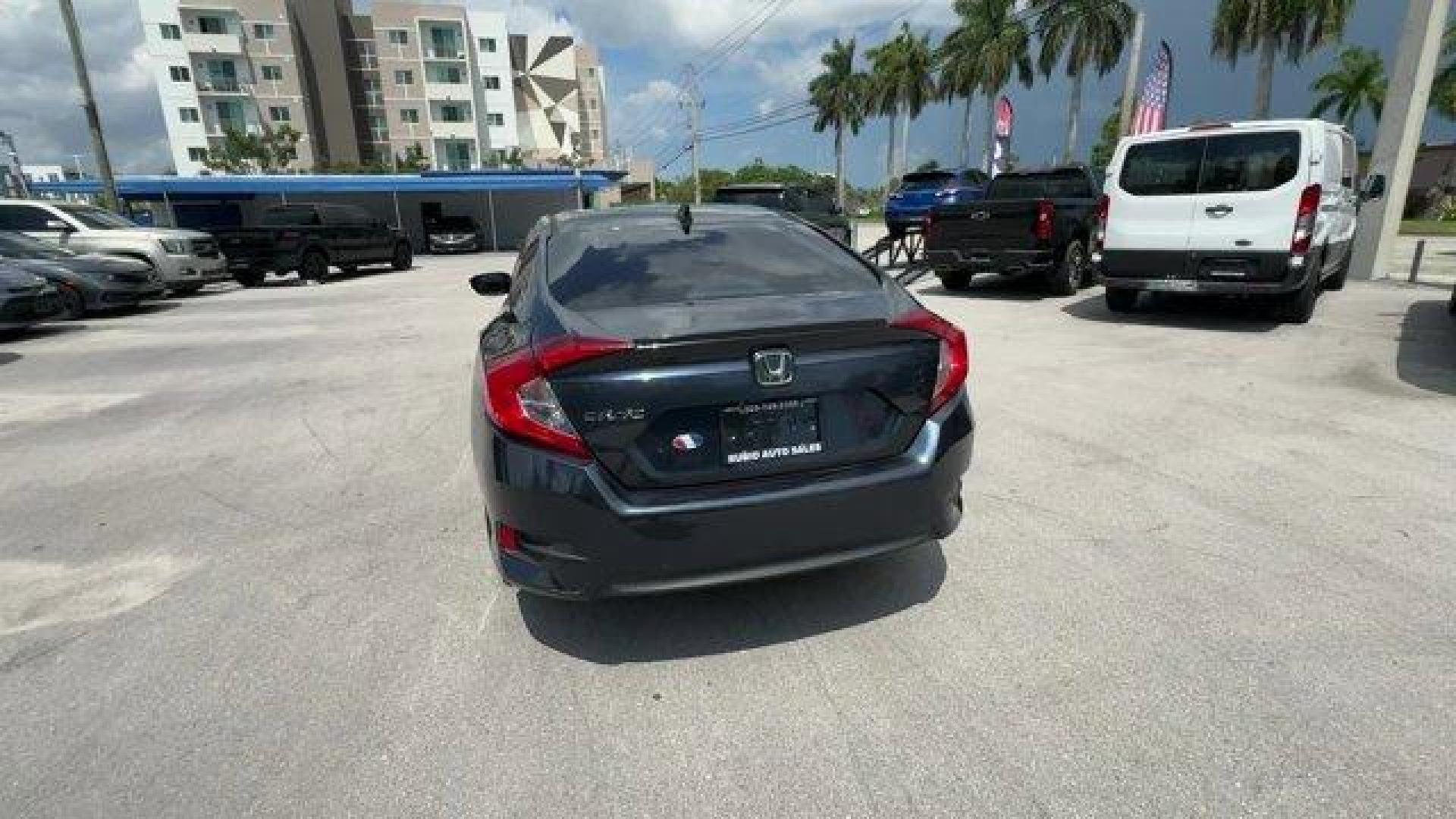 2016 Blue Honda Civic Sedan (19XFC1F36GE) with an 4 1.5 L engine, Variable transmission, located at 27610 S Dixie Hwy, Homestead, FL, 33032, (305) 749-2348, 25.510241, -80.438301 - IIHS Top Safety Pick+. Scores 42 Highway MPG and 31 City MPG! This Honda Civic Sedan delivers a Intercooled Turbo Regular Unleaded I-4 1.5 L/91 engine powering this Variable transmission. Wheels: 17 Alloy, Wheels w/Silver Accents, VSA Electronic Stability Control (ESC).*This Honda Civic Sedan Comes - Photo#3