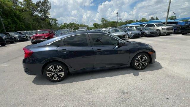 2016 Blue Honda Civic Sedan (19XFC1F36GE) with an 4 1.5 L engine, Variable transmission, located at 27610 S Dixie Hwy, Homestead, FL, 33032, (305) 749-2348, 25.510241, -80.438301 - IIHS Top Safety Pick+. Scores 42 Highway MPG and 31 City MPG! This Honda Civic Sedan delivers a Intercooled Turbo Regular Unleaded I-4 1.5 L/91 engine powering this Variable transmission. Wheels: 17 Alloy, Wheels w/Silver Accents, VSA Electronic Stability Control (ESC).*This Honda Civic Sedan Comes - Photo#5