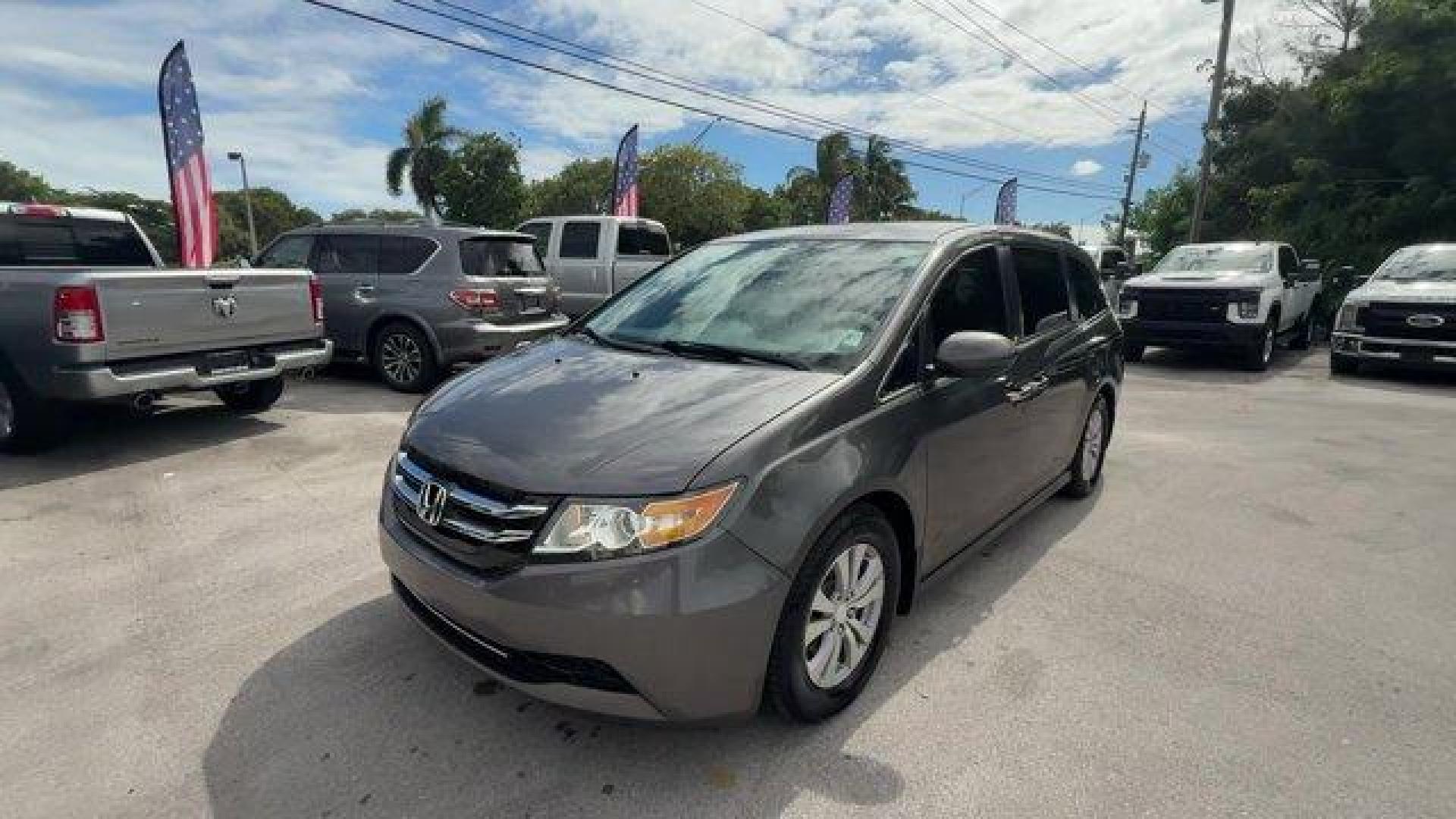 2014 Gray Honda Odyssey (5FNRL5H47EB) with an 6 3.5 L engine, Automatic transmission, located at 27610 S Dixie Hwy, Homestead, FL, 33032, (305) 749-2348, 25.510241, -80.438301 - IIHS Top Safety Pick+. Boasts 28 Highway MPG and 19 City MPG! This Honda Odyssey delivers a Regular Unleaded V-6 3.5 L/212 engine powering this Automatic transmission. Window Grid Antenna, Wheels: 17 x 7 Alloy, VSA Electronic Stability Control (ESC).*This Honda Odyssey Comes Equipped with These Opti - Photo#0
