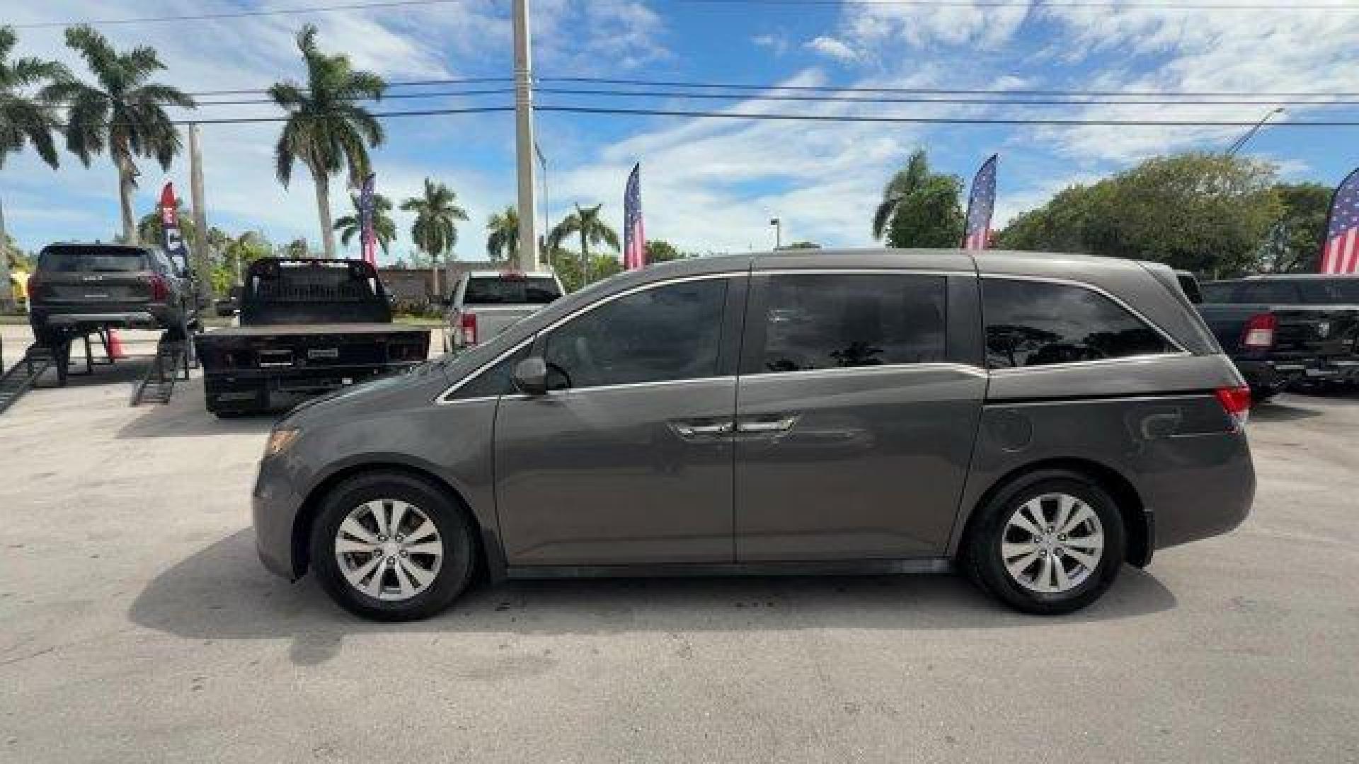 2014 Gray Honda Odyssey (5FNRL5H47EB) with an 6 3.5 L engine, Automatic transmission, located at 27610 S Dixie Hwy, Homestead, FL, 33032, (305) 749-2348, 25.510241, -80.438301 - IIHS Top Safety Pick+. Boasts 28 Highway MPG and 19 City MPG! This Honda Odyssey delivers a Regular Unleaded V-6 3.5 L/212 engine powering this Automatic transmission. Window Grid Antenna, Wheels: 17 x 7 Alloy, VSA Electronic Stability Control (ESC).*This Honda Odyssey Comes Equipped with These Opti - Photo#1