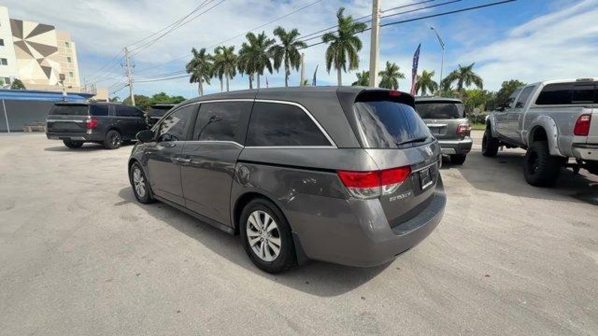 2014 Gray Honda Odyssey (5FNRL5H47EB) with an 6 3.5 L engine, Automatic transmission, located at 27610 S Dixie Hwy, Homestead, FL, 33032, (305) 749-2348, 25.510241, -80.438301 - IIHS Top Safety Pick+. Boasts 28 Highway MPG and 19 City MPG! This Honda Odyssey delivers a Regular Unleaded V-6 3.5 L/212 engine powering this Automatic transmission. Window Grid Antenna, Wheels: 17 x 7 Alloy, VSA Electronic Stability Control (ESC).*This Honda Odyssey Comes Equipped with These Opti - Photo#2