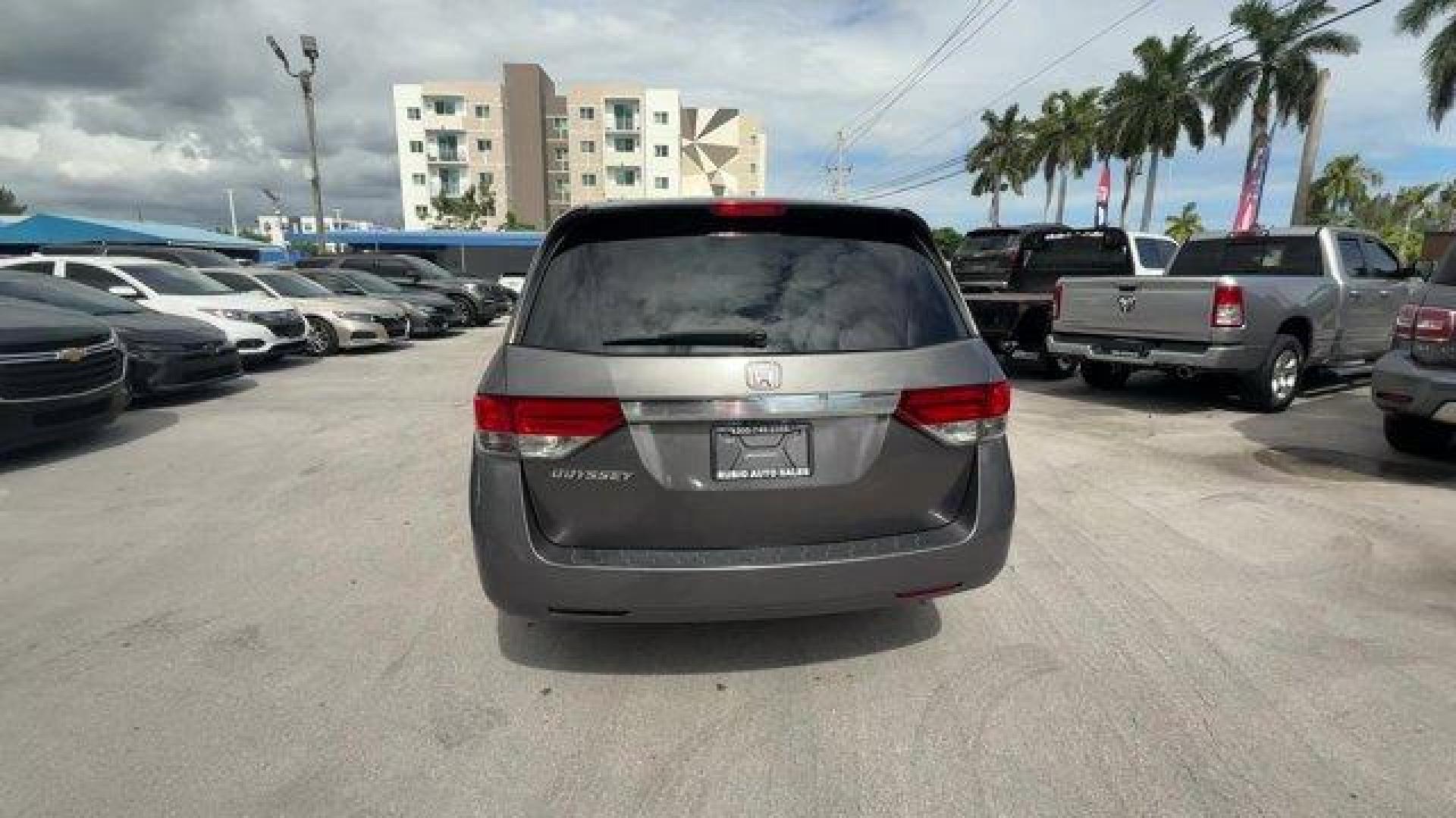 2014 Gray Honda Odyssey (5FNRL5H47EB) with an 6 3.5 L engine, Automatic transmission, located at 27610 S Dixie Hwy, Homestead, FL, 33032, (305) 749-2348, 25.510241, -80.438301 - IIHS Top Safety Pick+. Boasts 28 Highway MPG and 19 City MPG! This Honda Odyssey delivers a Regular Unleaded V-6 3.5 L/212 engine powering this Automatic transmission. Window Grid Antenna, Wheels: 17 x 7 Alloy, VSA Electronic Stability Control (ESC).*This Honda Odyssey Comes Equipped with These Opti - Photo#3