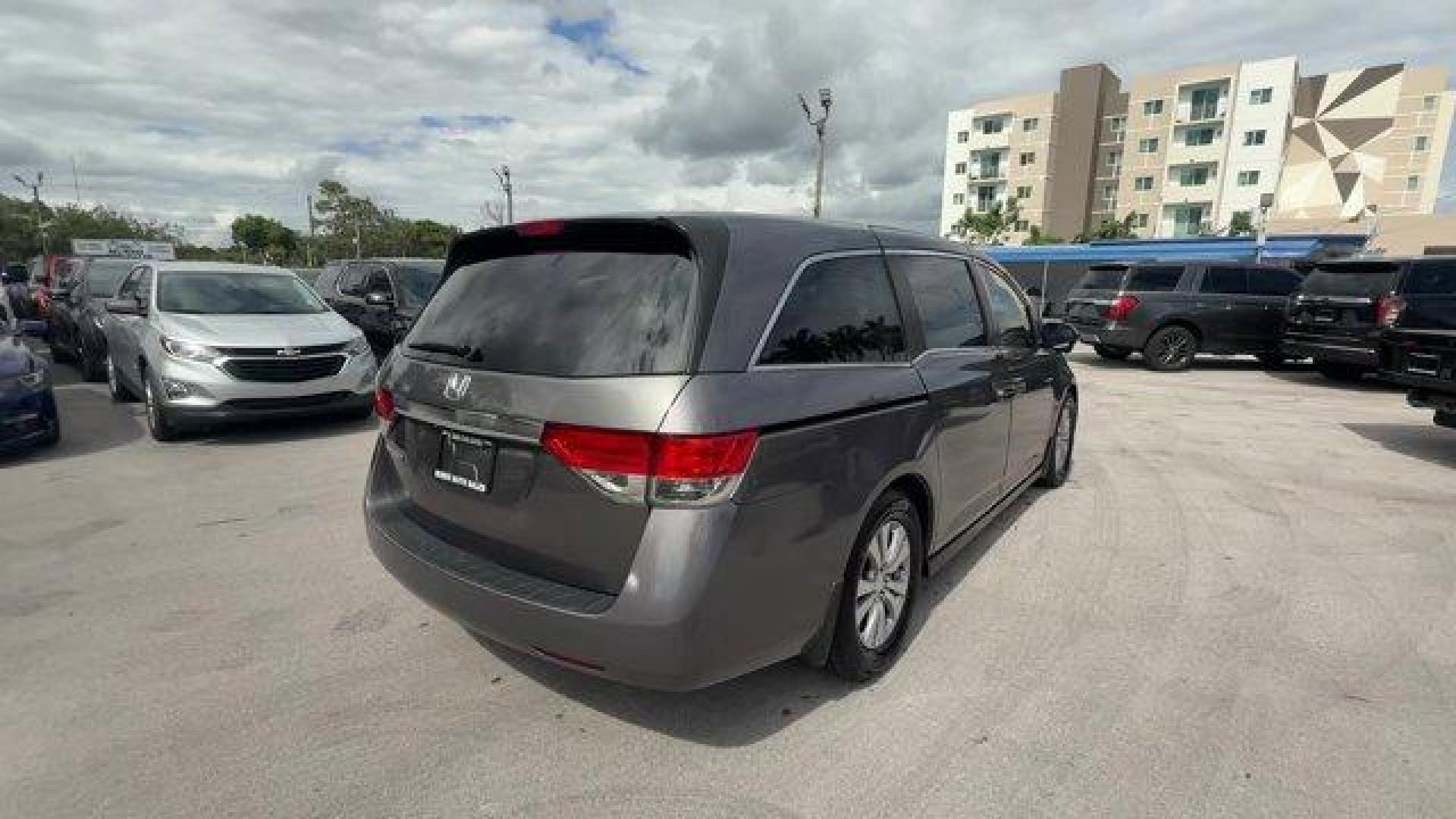 2014 Gray Honda Odyssey (5FNRL5H47EB) with an 6 3.5 L engine, Automatic transmission, located at 27610 S Dixie Hwy, Homestead, FL, 33032, (305) 749-2348, 25.510241, -80.438301 - IIHS Top Safety Pick+. Boasts 28 Highway MPG and 19 City MPG! This Honda Odyssey delivers a Regular Unleaded V-6 3.5 L/212 engine powering this Automatic transmission. Window Grid Antenna, Wheels: 17 x 7 Alloy, VSA Electronic Stability Control (ESC).*This Honda Odyssey Comes Equipped with These Opti - Photo#4