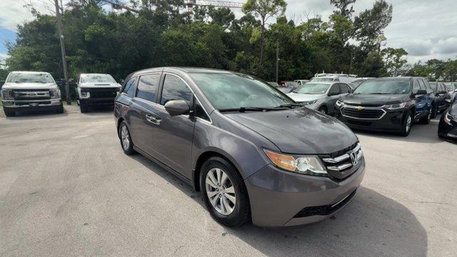 2014 Gray Honda Odyssey (5FNRL5H47EB) with an 6 3.5 L engine, Automatic transmission, located at 27610 S Dixie Hwy, Homestead, FL, 33032, (305) 749-2348, 25.510241, -80.438301 - IIHS Top Safety Pick+. Boasts 28 Highway MPG and 19 City MPG! This Honda Odyssey delivers a Regular Unleaded V-6 3.5 L/212 engine powering this Automatic transmission. Window Grid Antenna, Wheels: 17 x 7 Alloy, VSA Electronic Stability Control (ESC).*This Honda Odyssey Comes Equipped with These Opti - Photo#6