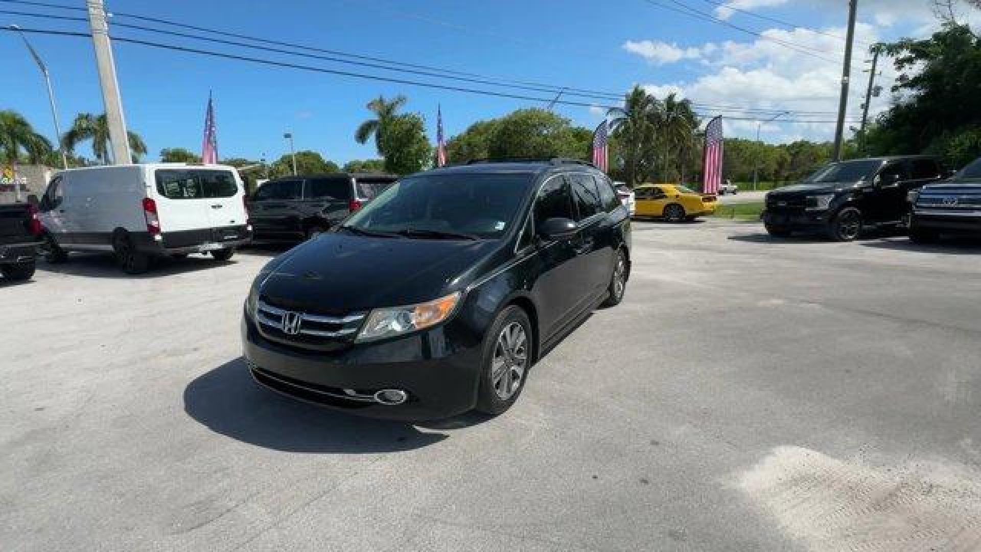 2014 Black Honda Odyssey (5FNRL5H97EB) with an 6 3.5 L engine, Automatic transmission, located at 27610 S Dixie Hwy, Homestead, FL, 33032, (305) 749-2348, 25.510241, -80.438301 - KBB.com 12 Best Family Cars. Scores 28 Highway MPG and 19 City MPG! This Honda Odyssey delivers a Regular Unleaded V-6 3.5 L/212 engine powering this Automatic transmission. Window Grid Antenna, Wheels: 18 x 7 Alloy, VSA Electronic Stability Control (ESC).* This Honda Odyssey Features the Following - Photo#0