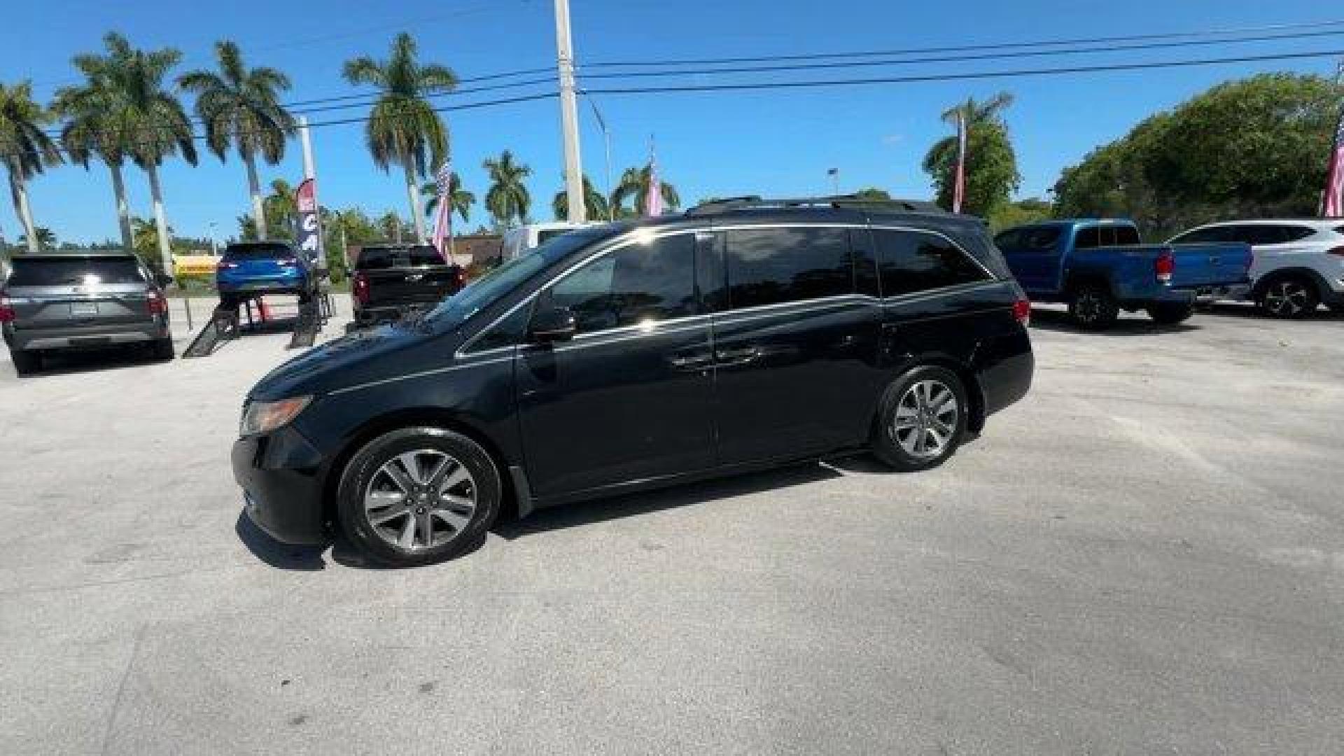 2014 Black Honda Odyssey (5FNRL5H97EB) with an 6 3.5 L engine, Automatic transmission, located at 27610 S Dixie Hwy, Homestead, FL, 33032, (305) 749-2348, 25.510241, -80.438301 - KBB.com 12 Best Family Cars. Scores 28 Highway MPG and 19 City MPG! This Honda Odyssey delivers a Regular Unleaded V-6 3.5 L/212 engine powering this Automatic transmission. Window Grid Antenna, Wheels: 18 x 7 Alloy, VSA Electronic Stability Control (ESC).* This Honda Odyssey Features the Following - Photo#1