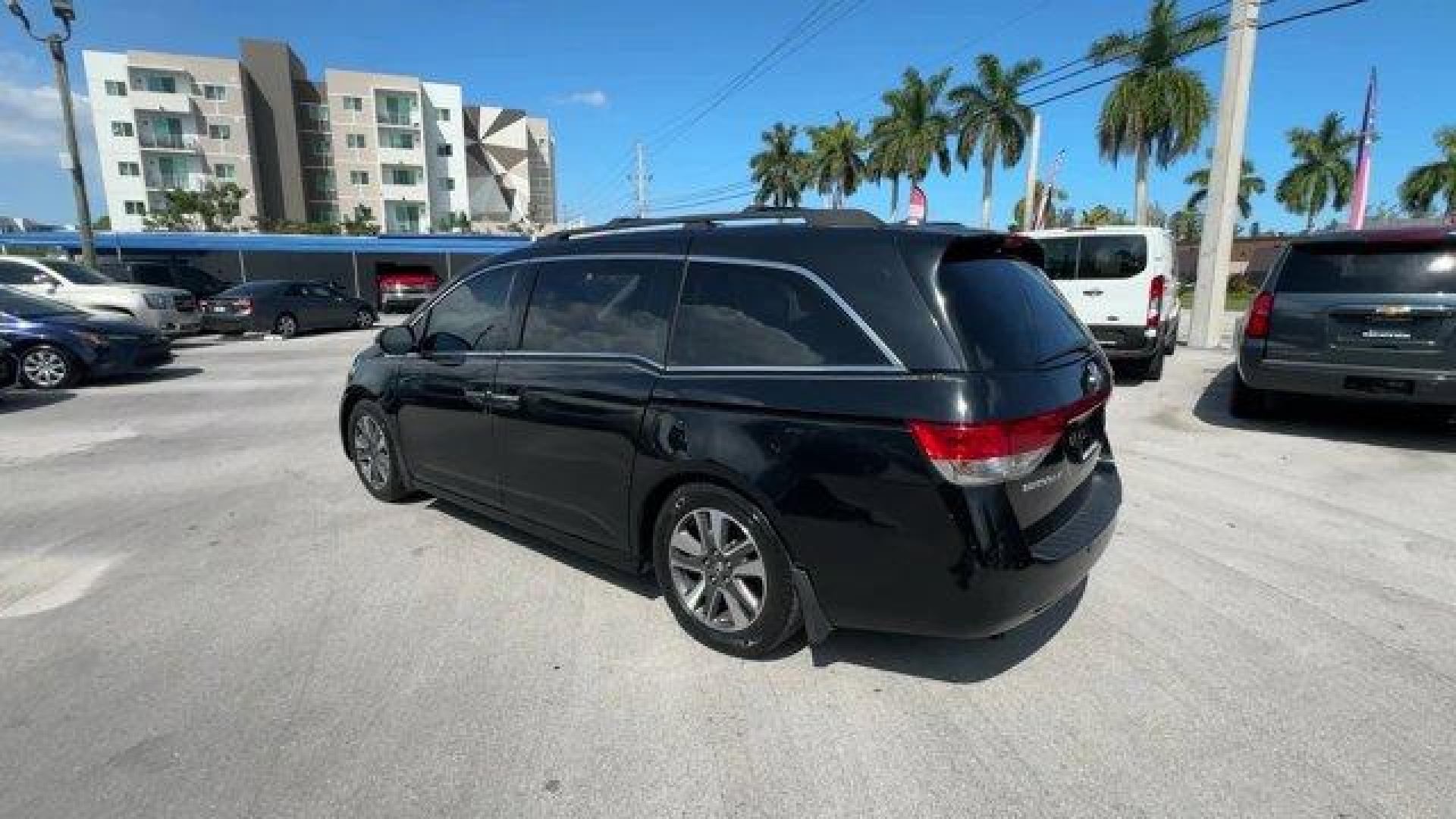 2014 Black Honda Odyssey (5FNRL5H97EB) with an 6 3.5 L engine, Automatic transmission, located at 27610 S Dixie Hwy, Homestead, FL, 33032, (305) 749-2348, 25.510241, -80.438301 - KBB.com 12 Best Family Cars. Scores 28 Highway MPG and 19 City MPG! This Honda Odyssey delivers a Regular Unleaded V-6 3.5 L/212 engine powering this Automatic transmission. Window Grid Antenna, Wheels: 18 x 7 Alloy, VSA Electronic Stability Control (ESC).* This Honda Odyssey Features the Following - Photo#2