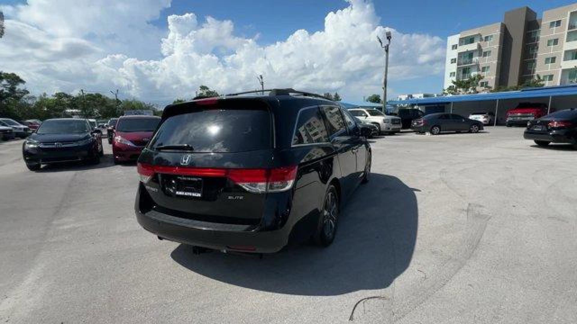 2014 Black Honda Odyssey (5FNRL5H97EB) with an 6 3.5 L engine, Automatic transmission, located at 27610 S Dixie Hwy, Homestead, FL, 33032, (305) 749-2348, 25.510241, -80.438301 - KBB.com 12 Best Family Cars. Scores 28 Highway MPG and 19 City MPG! This Honda Odyssey delivers a Regular Unleaded V-6 3.5 L/212 engine powering this Automatic transmission. Window Grid Antenna, Wheels: 18 x 7 Alloy, VSA Electronic Stability Control (ESC).* This Honda Odyssey Features the Following - Photo#4