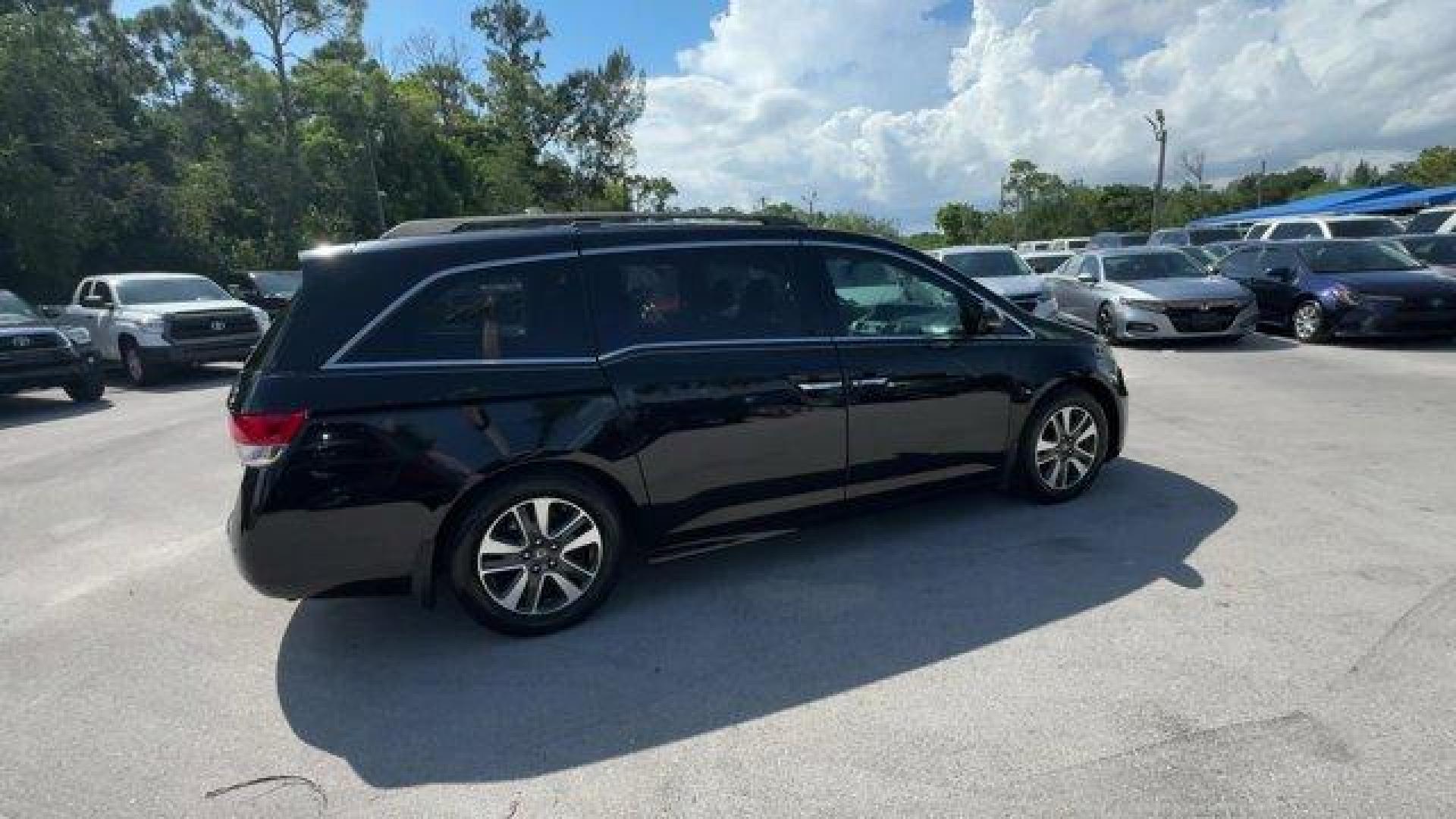 2014 Black Honda Odyssey (5FNRL5H97EB) with an 6 3.5 L engine, Automatic transmission, located at 27610 S Dixie Hwy, Homestead, FL, 33032, (305) 749-2348, 25.510241, -80.438301 - KBB.com 12 Best Family Cars. Scores 28 Highway MPG and 19 City MPG! This Honda Odyssey delivers a Regular Unleaded V-6 3.5 L/212 engine powering this Automatic transmission. Window Grid Antenna, Wheels: 18 x 7 Alloy, VSA Electronic Stability Control (ESC).* This Honda Odyssey Features the Following - Photo#5