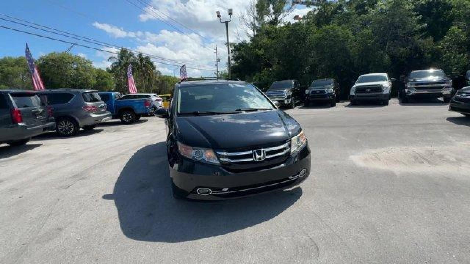 2014 Black Honda Odyssey (5FNRL5H97EB) with an 6 3.5 L engine, Automatic transmission, located at 27610 S Dixie Hwy, Homestead, FL, 33032, (305) 749-2348, 25.510241, -80.438301 - KBB.com 12 Best Family Cars. Scores 28 Highway MPG and 19 City MPG! This Honda Odyssey delivers a Regular Unleaded V-6 3.5 L/212 engine powering this Automatic transmission. Window Grid Antenna, Wheels: 18 x 7 Alloy, VSA Electronic Stability Control (ESC).* This Honda Odyssey Features the Following - Photo#7