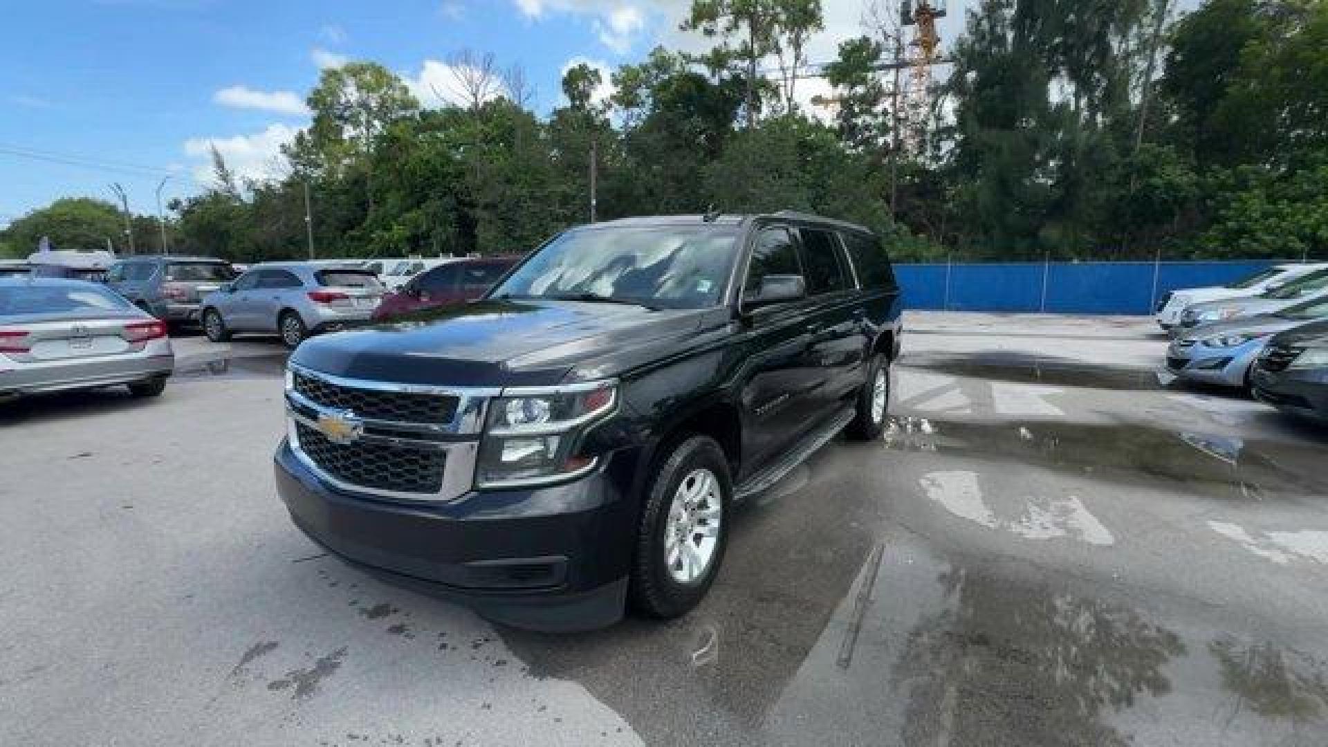2016 Black /Jet Black Chevrolet Suburban (1GNSCHKC7GR) with an 8 5.3L engine, Automatic transmission, located at 27610 S Dixie Hwy, Homestead, FL, 33032, (305) 749-2348, 25.510241, -80.438301 - Delivers 23 Highway MPG and 16 City MPG! This Chevrolet Suburban boasts a Gas/Ethanol V8 5.3L/ engine powering this Automatic transmission. WHEELS, 18 X 8.5 (45.7 CM X 21.6 CM) ALUMINUM WITH HIGH-POLISHED FINISH (STD), TRANSMISSION, 6-SPEED AUTOMATIC, ELECTRONICALLY CONTROLLED with overdrive and tow - Photo#0