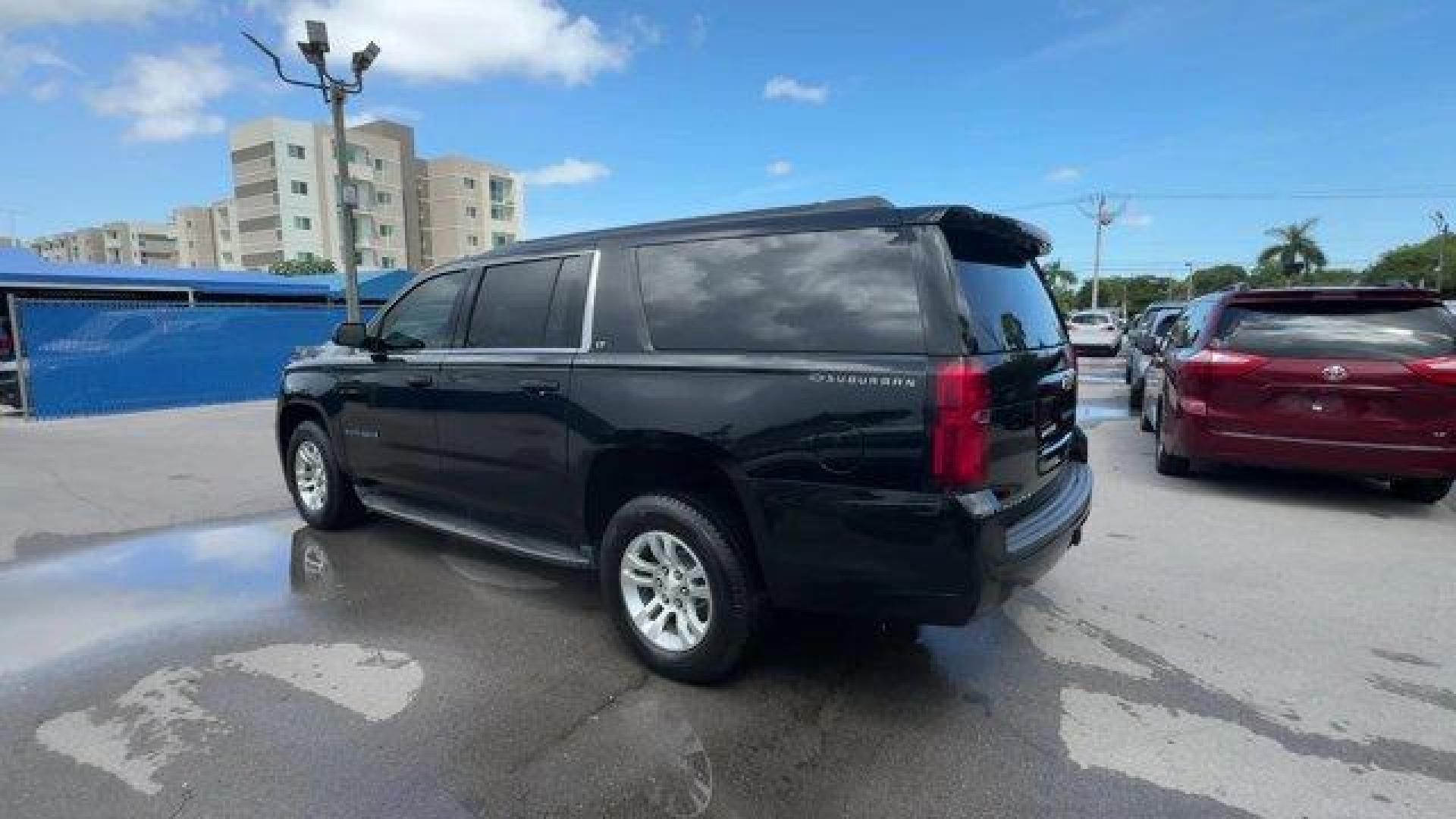 2016 Black /Jet Black Chevrolet Suburban (1GNSCHKC7GR) with an 8 5.3L engine, Automatic transmission, located at 27610 S Dixie Hwy, Homestead, FL, 33032, (305) 749-2348, 25.510241, -80.438301 - Delivers 23 Highway MPG and 16 City MPG! This Chevrolet Suburban boasts a Gas/Ethanol V8 5.3L/ engine powering this Automatic transmission. WHEELS, 18 X 8.5 (45.7 CM X 21.6 CM) ALUMINUM WITH HIGH-POLISHED FINISH (STD), TRANSMISSION, 6-SPEED AUTOMATIC, ELECTRONICALLY CONTROLLED with overdrive and tow - Photo#2