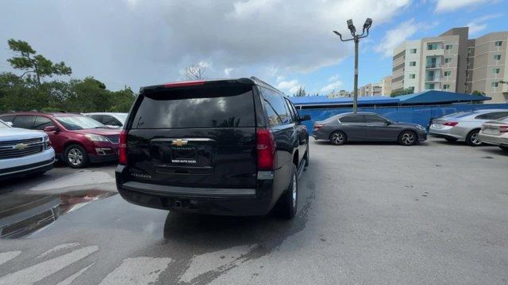 2016 Black /Jet Black Chevrolet Suburban (1GNSCHKC7GR) with an 8 5.3L engine, Automatic transmission, located at 27610 S Dixie Hwy, Homestead, FL, 33032, (305) 749-2348, 25.510241, -80.438301 - Delivers 23 Highway MPG and 16 City MPG! This Chevrolet Suburban boasts a Gas/Ethanol V8 5.3L/ engine powering this Automatic transmission. WHEELS, 18 X 8.5 (45.7 CM X 21.6 CM) ALUMINUM WITH HIGH-POLISHED FINISH (STD), TRANSMISSION, 6-SPEED AUTOMATIC, ELECTRONICALLY CONTROLLED with overdrive and tow - Photo#4
