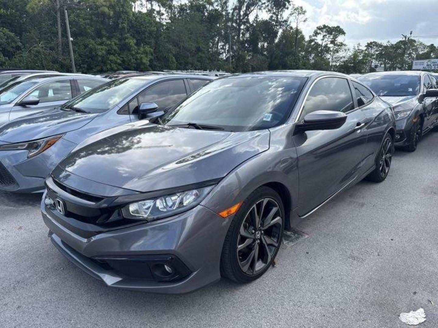 2020 Gray Honda Civic Coupe (2HGFC4B83LH) with an 4 2.0 L engine, Variable transmission, located at 27610 S Dixie Hwy, Homestead, FL, 33032, (305) 749-2348, 25.510241, -80.438301 - Only 32,352 Miles! Scores 36 Highway MPG and 29 City MPG! This Honda Civic Coupe boasts a Regular Unleaded I-4 2.0 L/122 engine powering this Variable transmission. Window Grid Antenna, Wheels: 18 Alloy w/Gloss Black Inserts, VSA Electronic Stability Control (ESC).*This Honda Civic Coupe Comes Equip - Photo#0