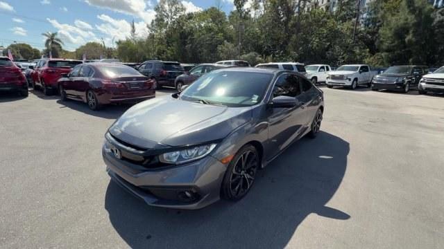 2020 Gray Honda Civic Coupe (2HGFC4B83LH) with an 4 2.0 L engine, Variable transmission, located at 27610 S Dixie Hwy, Homestead, FL, 33032, (305) 749-2348, 25.510241, -80.438301 - Only 32,352 Miles! Scores 36 Highway MPG and 29 City MPG! This Honda Civic Coupe boasts a Regular Unleaded I-4 2.0 L/122 engine powering this Variable transmission. Window Grid Antenna, Wheels: 18 Alloy w/Gloss Black Inserts, VSA Electronic Stability Control (ESC).*This Honda Civic Coupe Comes Equip - Photo#0