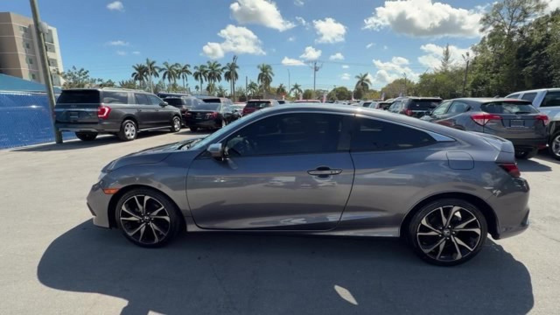 2020 Gray Honda Civic Coupe (2HGFC4B83LH) with an 4 2.0 L engine, Variable transmission, located at 27610 S Dixie Hwy, Homestead, FL, 33032, (305) 749-2348, 25.510241, -80.438301 - Only 32,352 Miles! Scores 36 Highway MPG and 29 City MPG! This Honda Civic Coupe boasts a Regular Unleaded I-4 2.0 L/122 engine powering this Variable transmission. Window Grid Antenna, Wheels: 18 Alloy w/Gloss Black Inserts, VSA Electronic Stability Control (ESC).*This Honda Civic Coupe Comes Equip - Photo#1